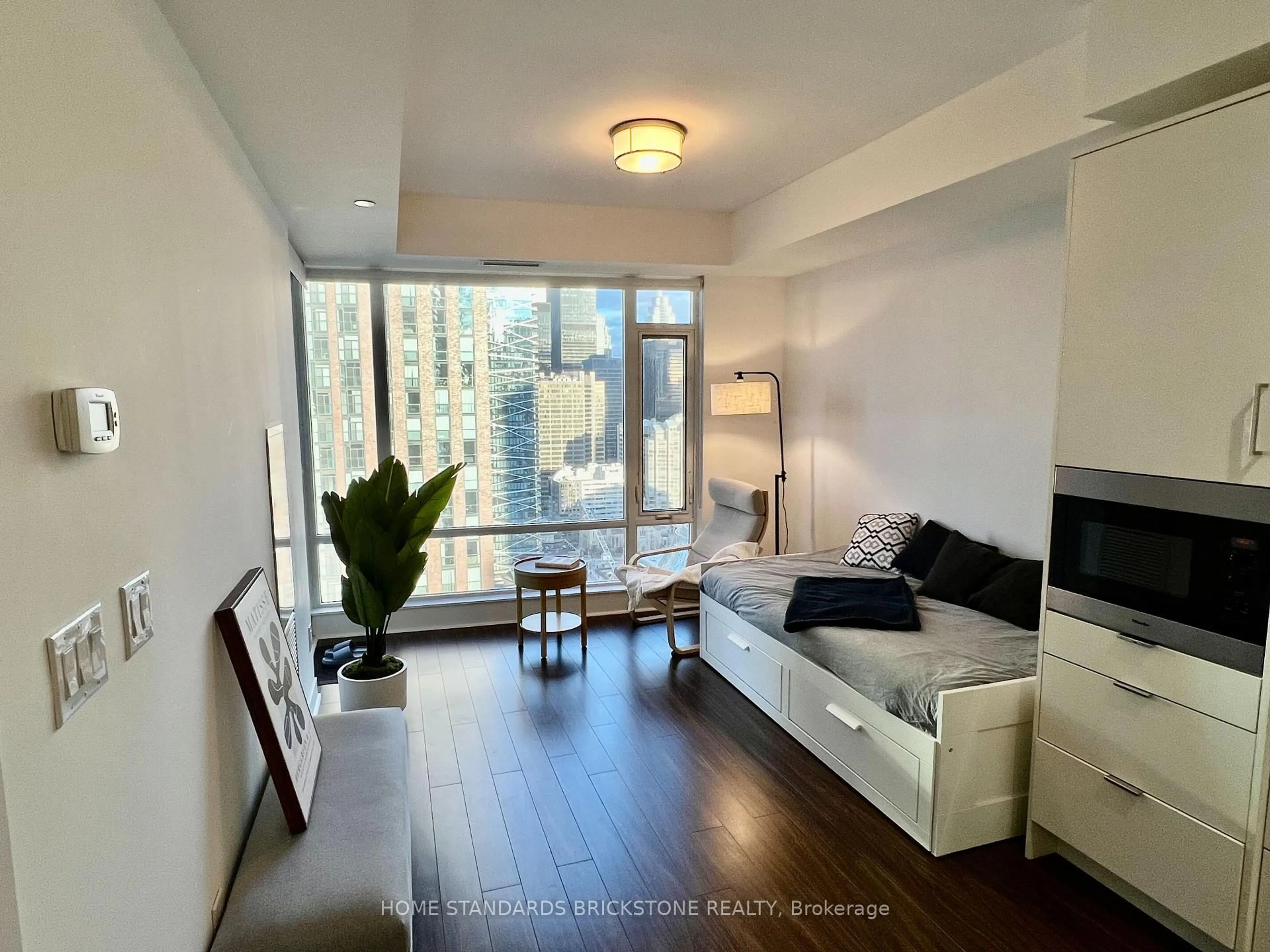 Living room with furniture, wood/laminate floor for 21 Widmer St #2908, Toronto Ontario M5V 0B8