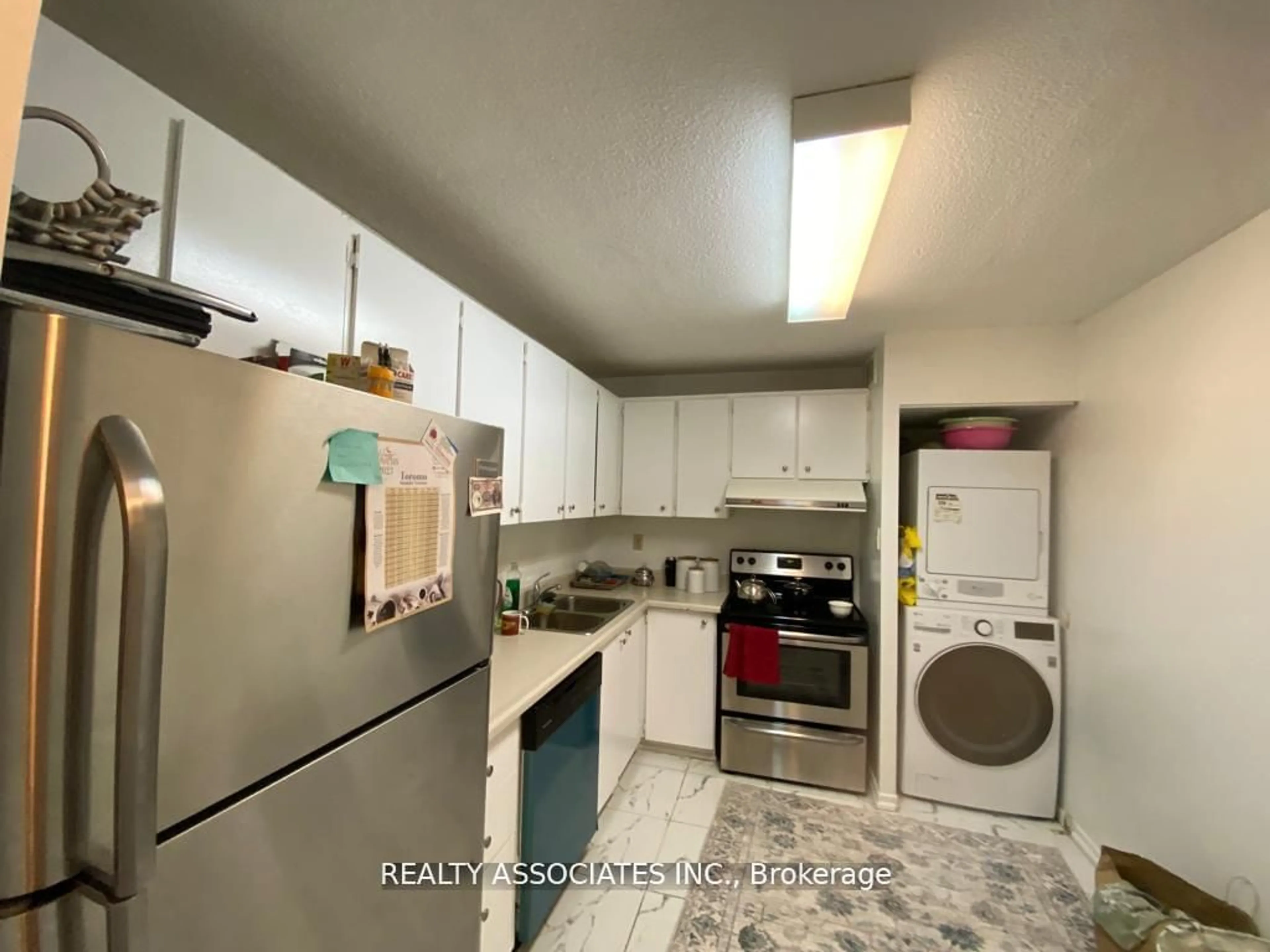 Kitchen with laundary machines, unknown for 10 Tangreen Crt #2104, Toronto Ontario M2M 4B9