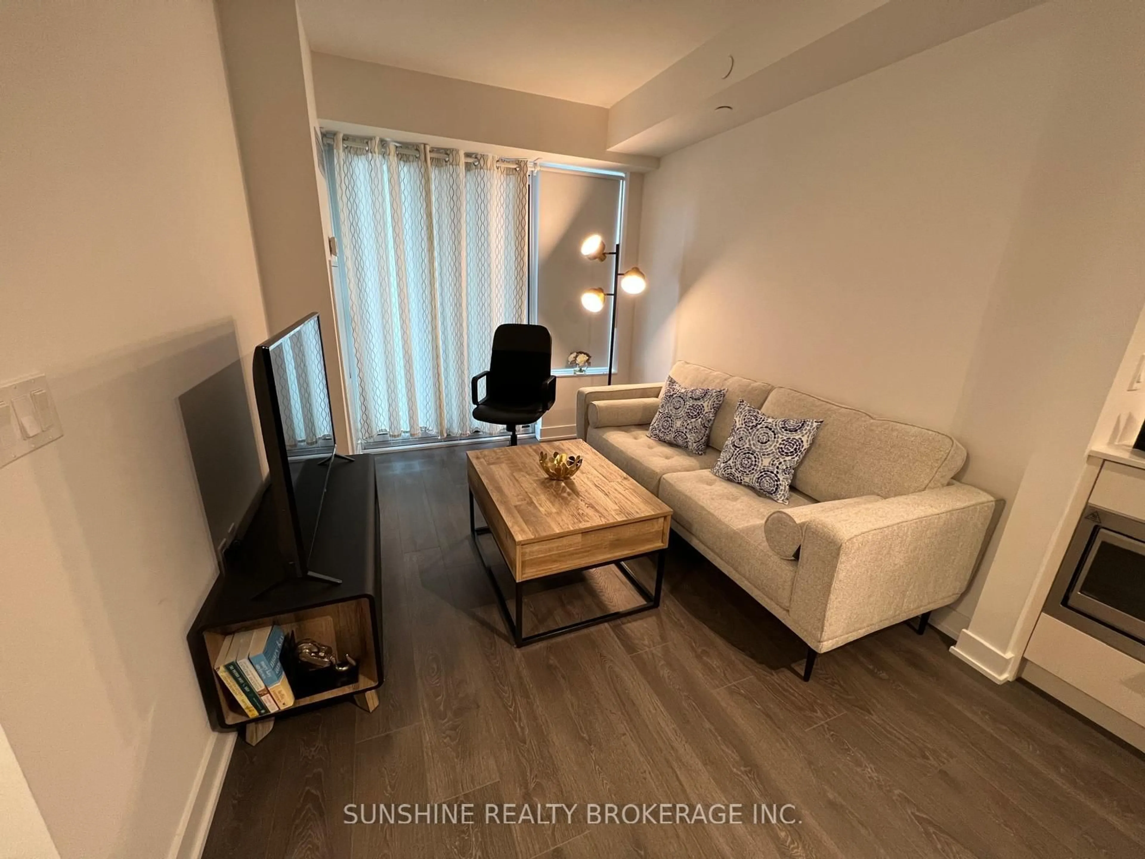 Living room with furniture, wood/laminate floor for 99 Broadway Ave #1607, Toronto Ontario M4P 0E3