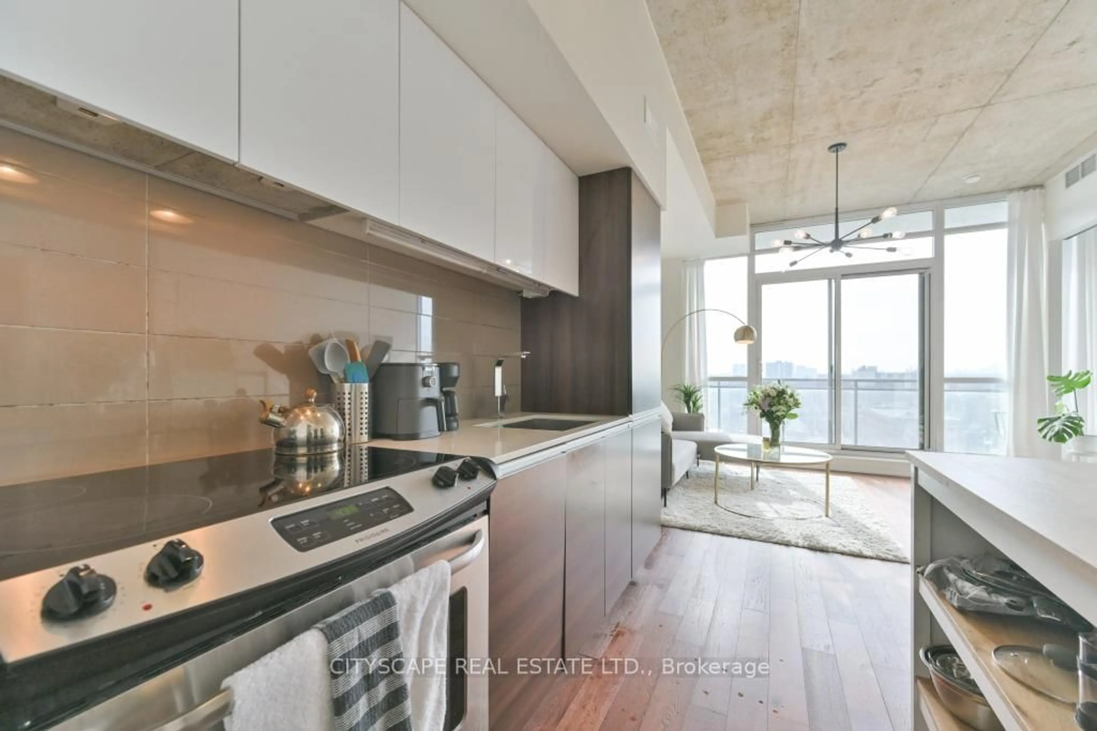 Open concept kitchen, cement floor for 20 Minown Miikan Lane #1110, Toronto Ontario M6J 0E5