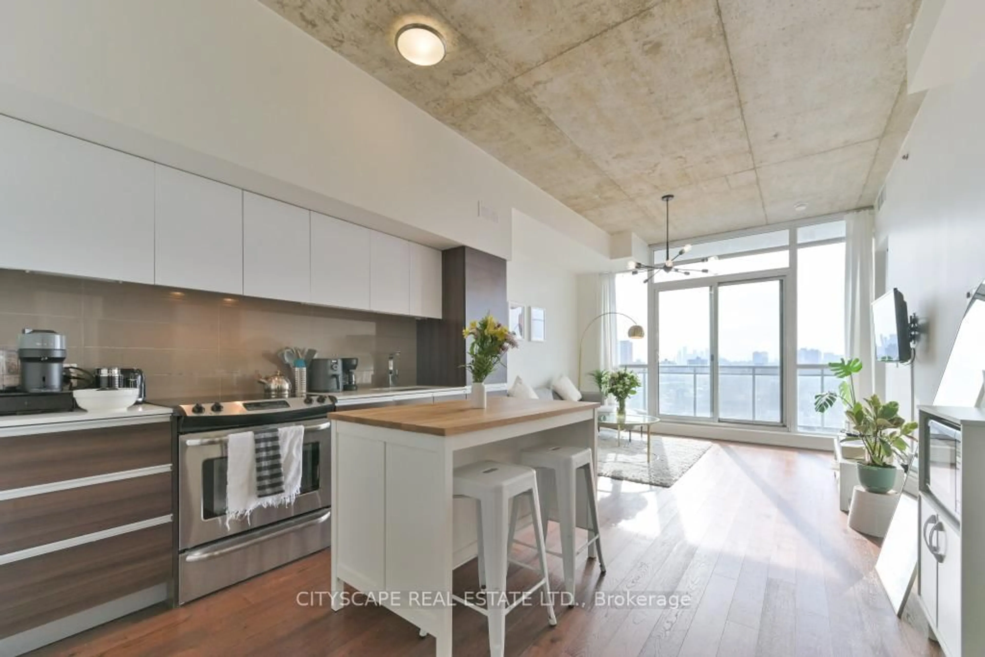 Open concept kitchen, cement floor for 20 Minown Miikan Lane #1110, Toronto Ontario M6J 0E5