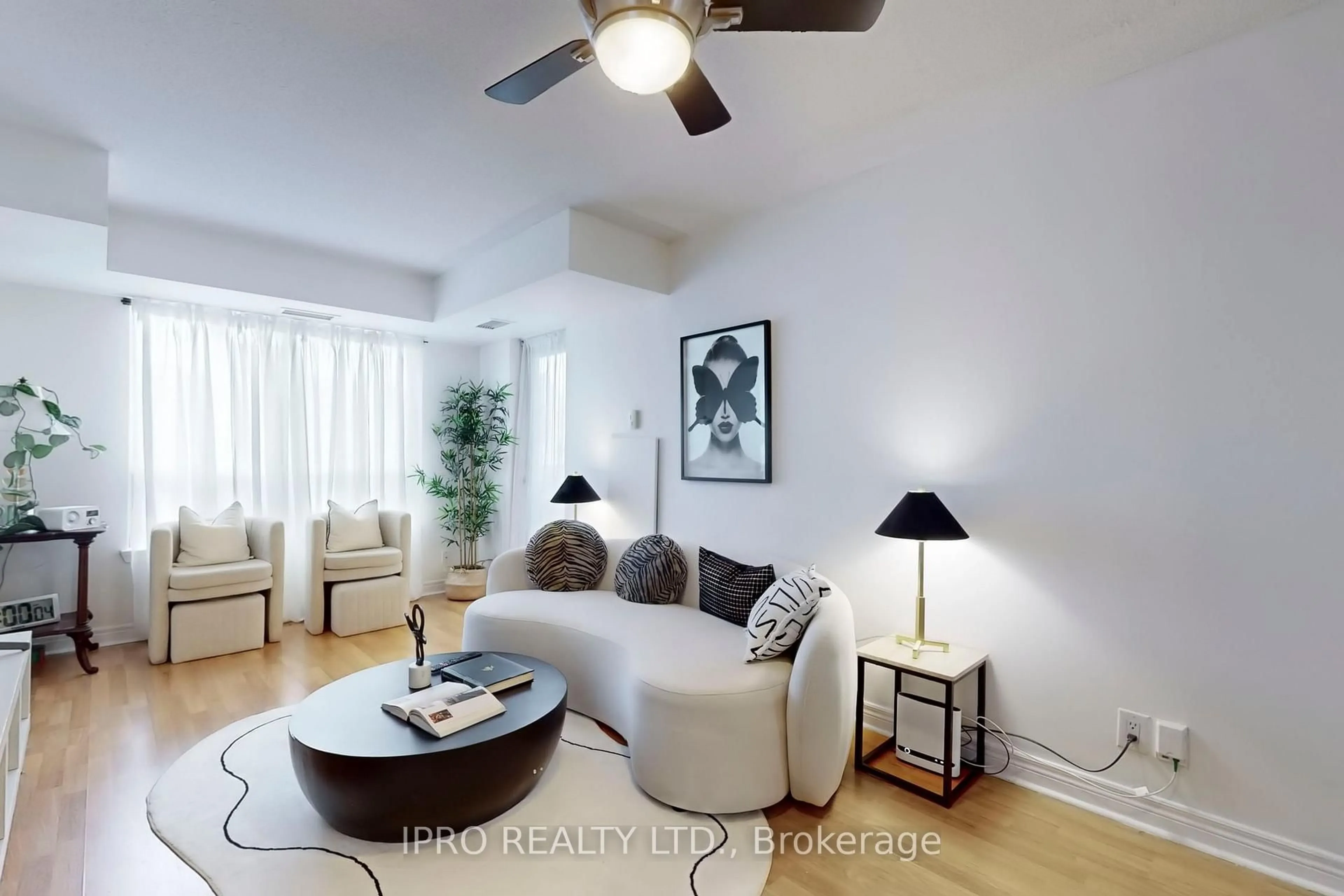 Living room with furniture, wood/laminate floor for 225 Wellesley St #701, Toronto Ontario M4X 1X8