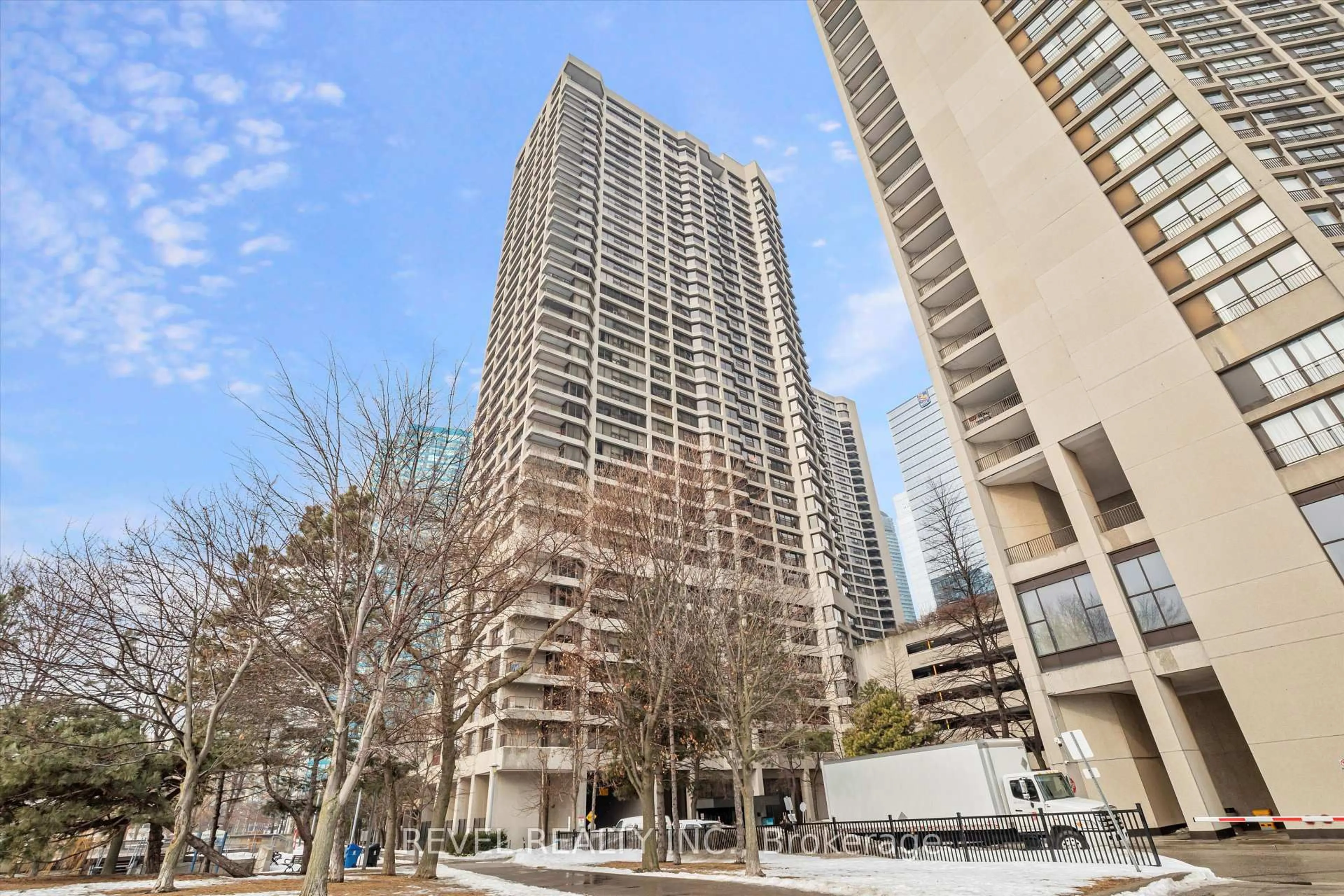 Patio, city buildings view from balcony for 65 Harbour Sq #2410, Toronto Ontario M5J 2L4