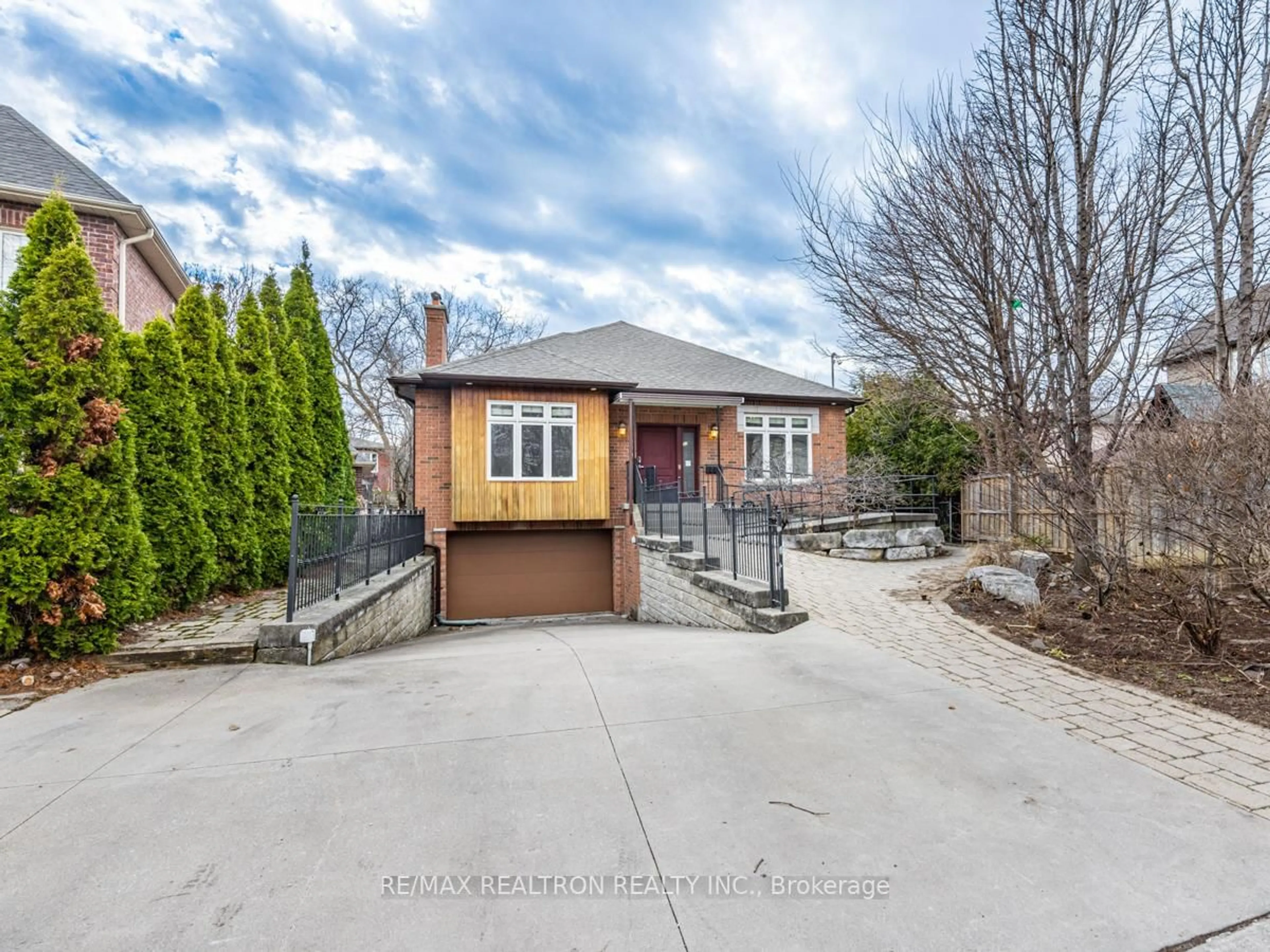 Home with brick exterior material, street for 32 Roberta Dr, Toronto Ontario M6A 2J5