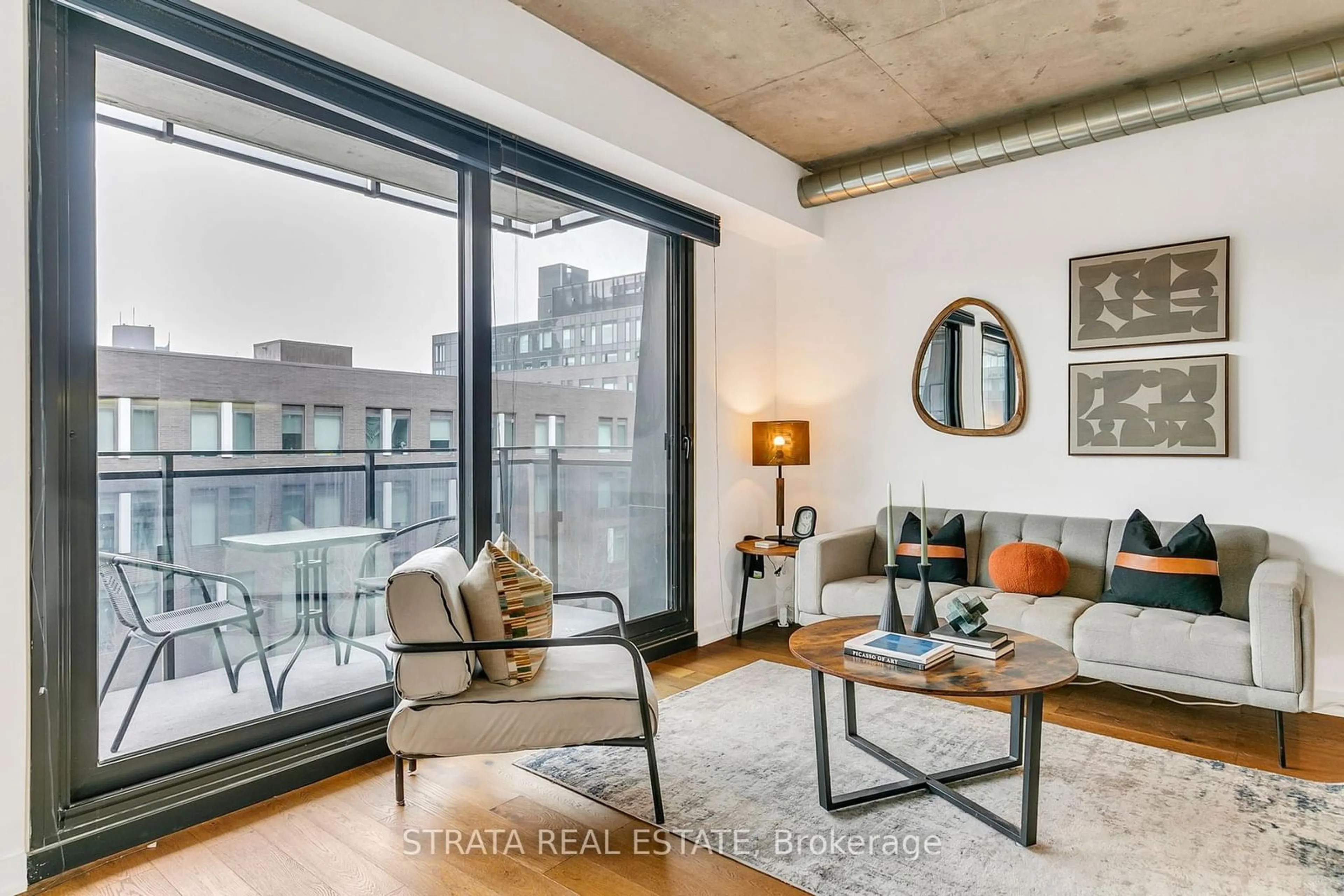 Living room with furniture, cement floor for 47 Lower River St #444, Toronto Ontario M5A 0G1