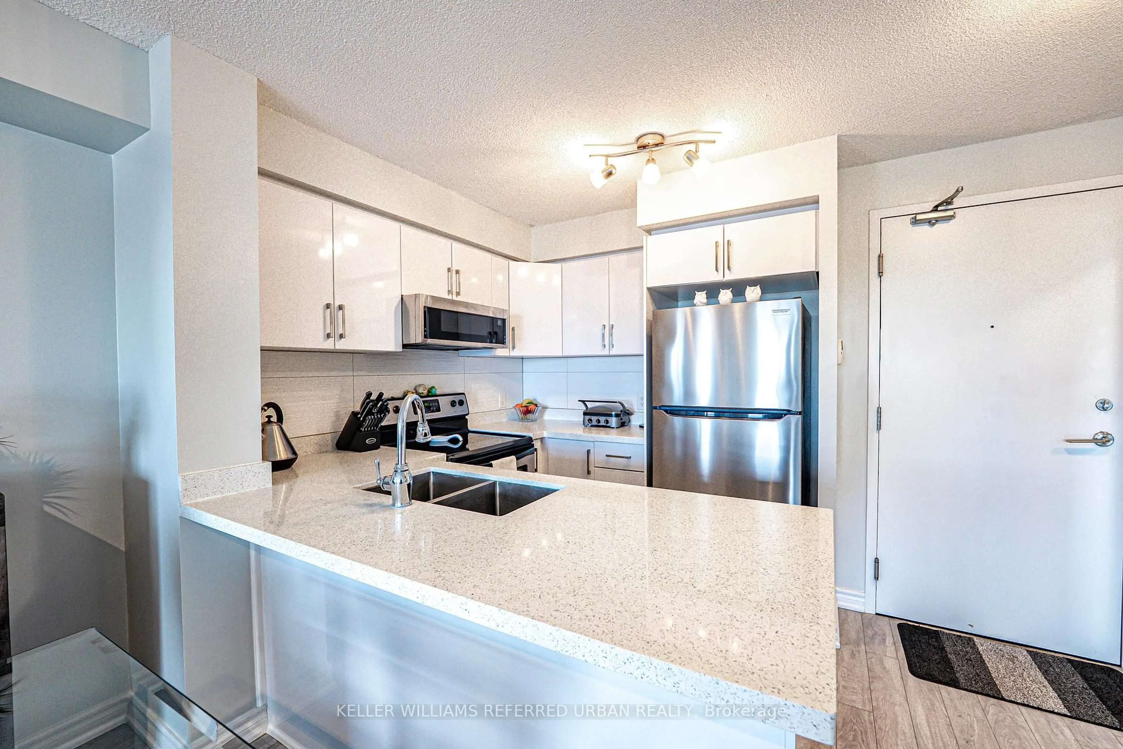 Open concept kitchen, ceramic/tile floor for 120 Dallimore Circ #705, Toronto Ontario M3C 4J1