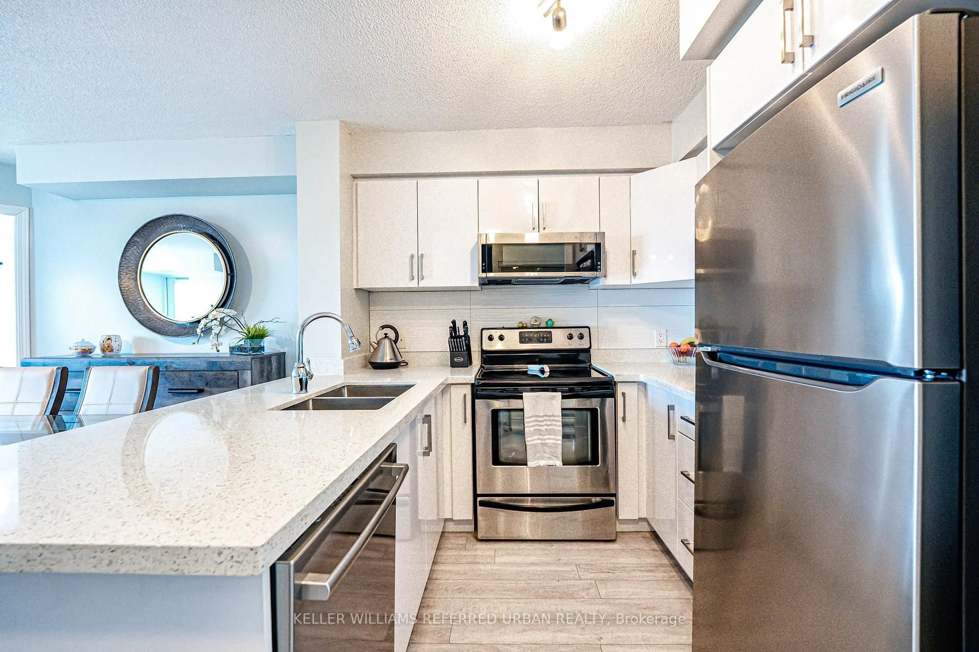 Open concept kitchen, ceramic/tile floor for 120 Dallimore Circ #705, Toronto Ontario M3C 4J1