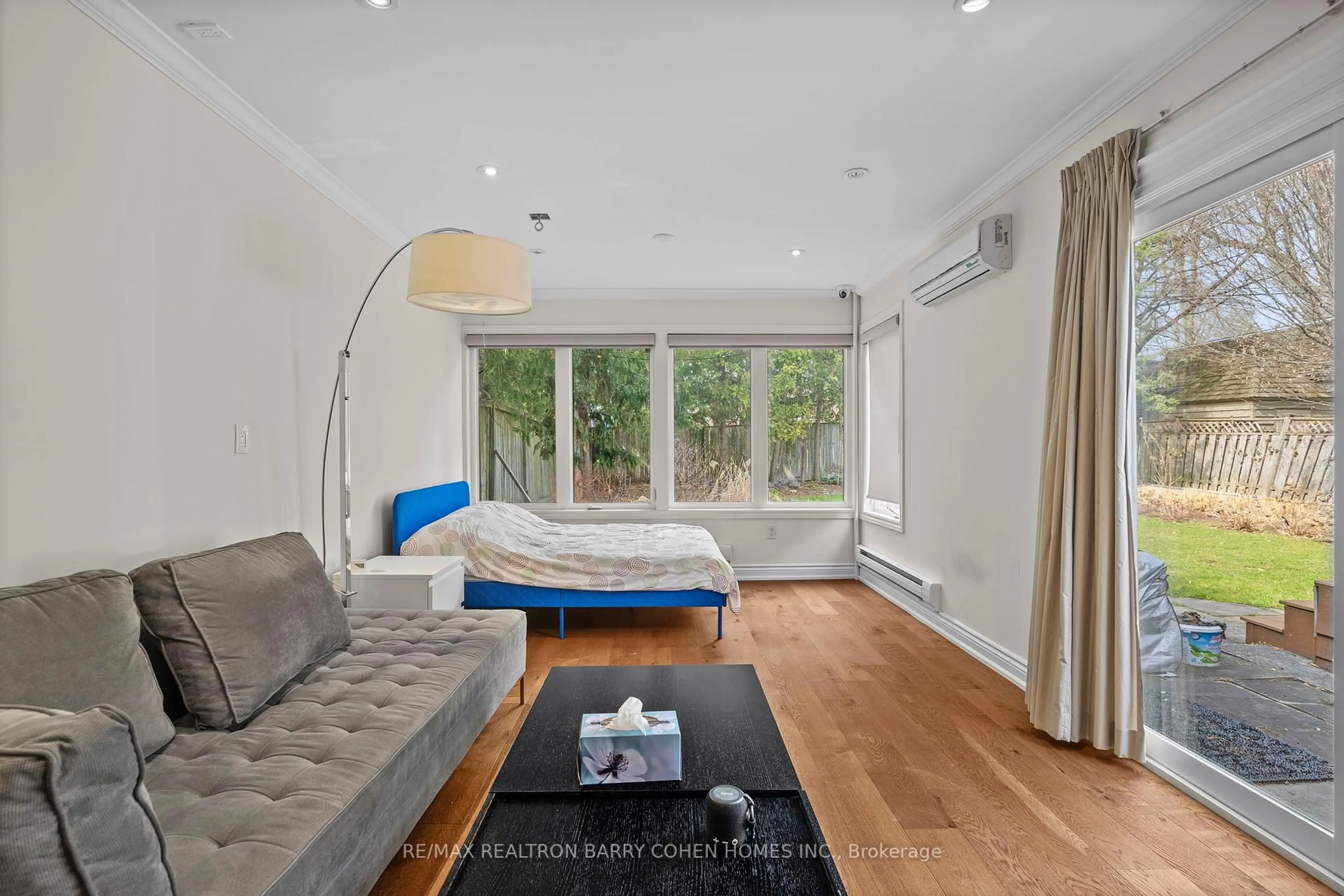 Living room with furniture, wood/laminate floor for 32 Beechwood Ave, Toronto Ontario M6N 4T1