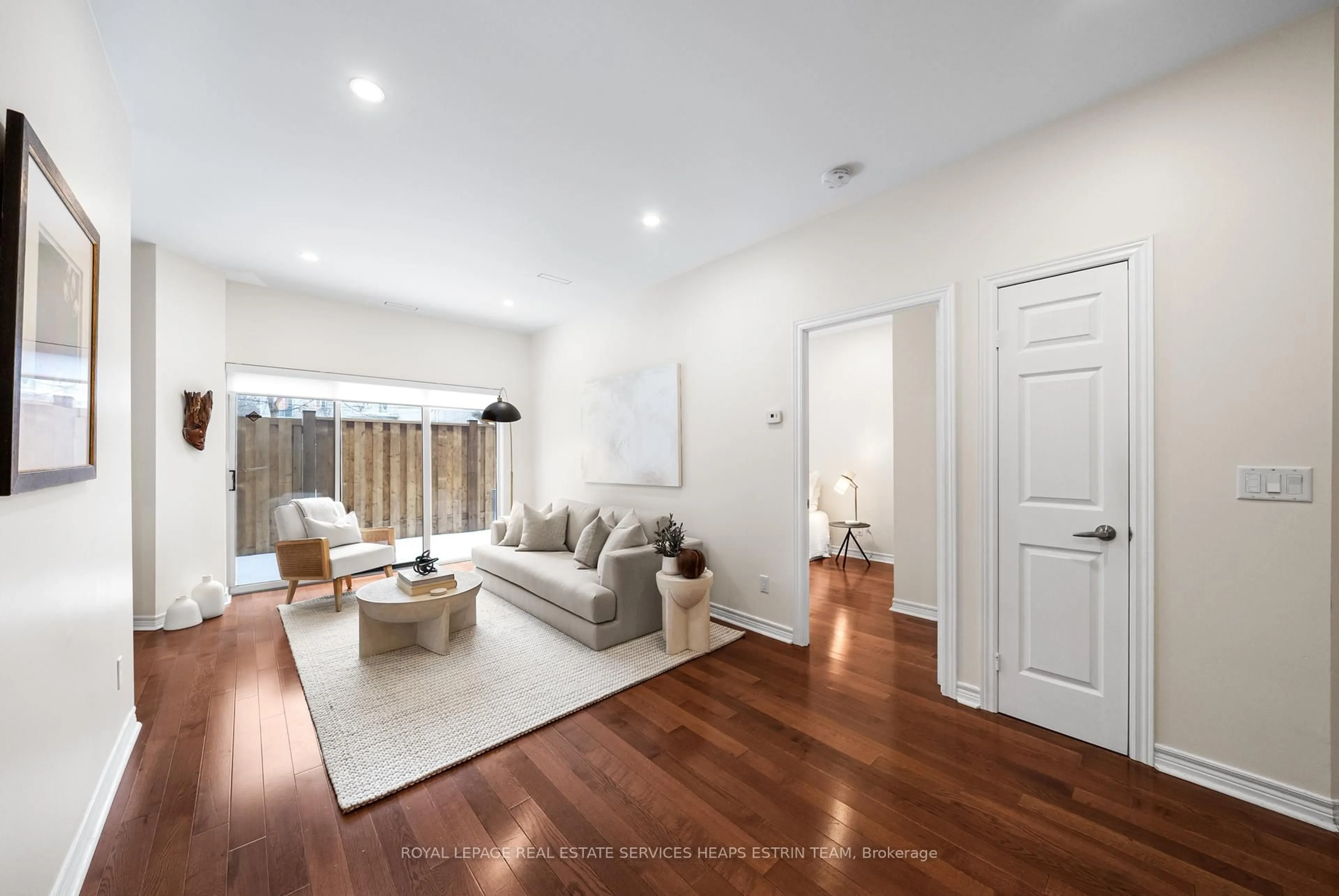 Living room with furniture, wood/laminate floor for 211 Randolph Rd #106, Toronto Ontario M4G 4H1