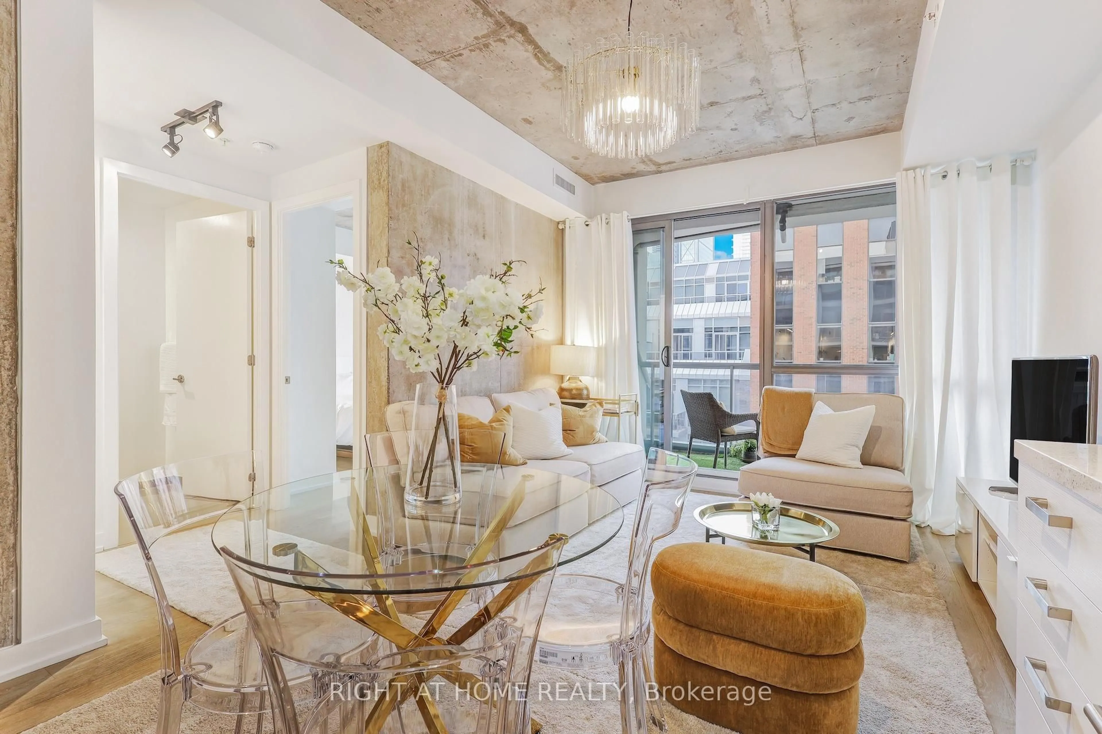 Living room with furniture, cement floor for 39 Brant St #919, Toronto Ontario M5V 2L9