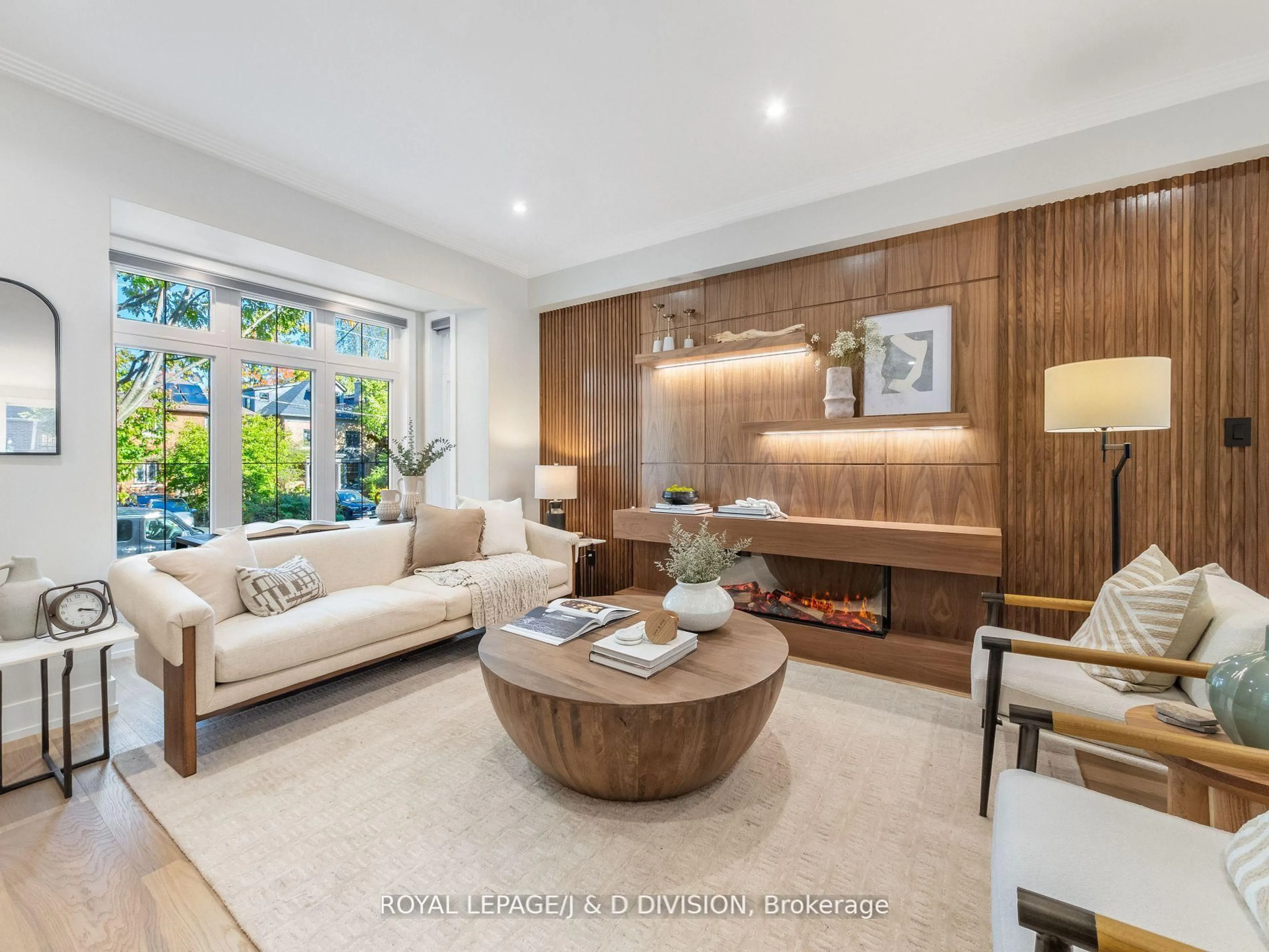 Living room with furniture, wood/laminate floor for 79 Chudleigh Ave, Toronto Ontario M4R 1T4