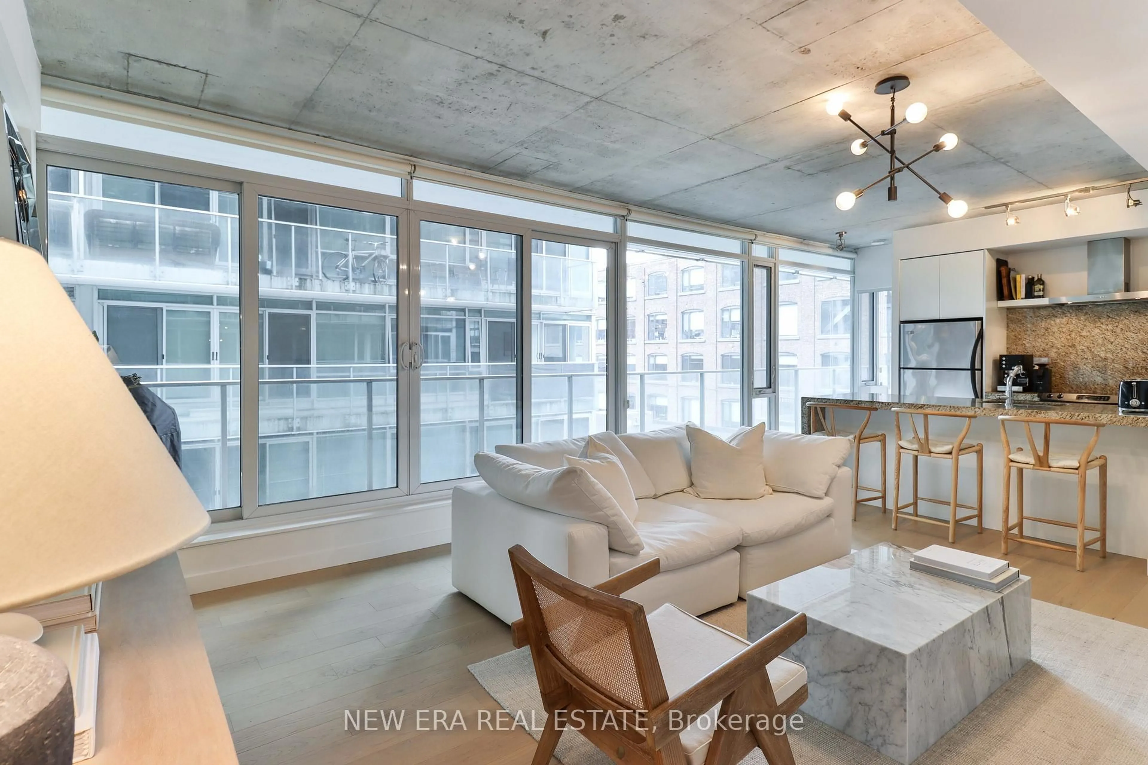 Living room with furniture, cement floor for 75 Portland St #423, Toronto Ontario M5V 2M9