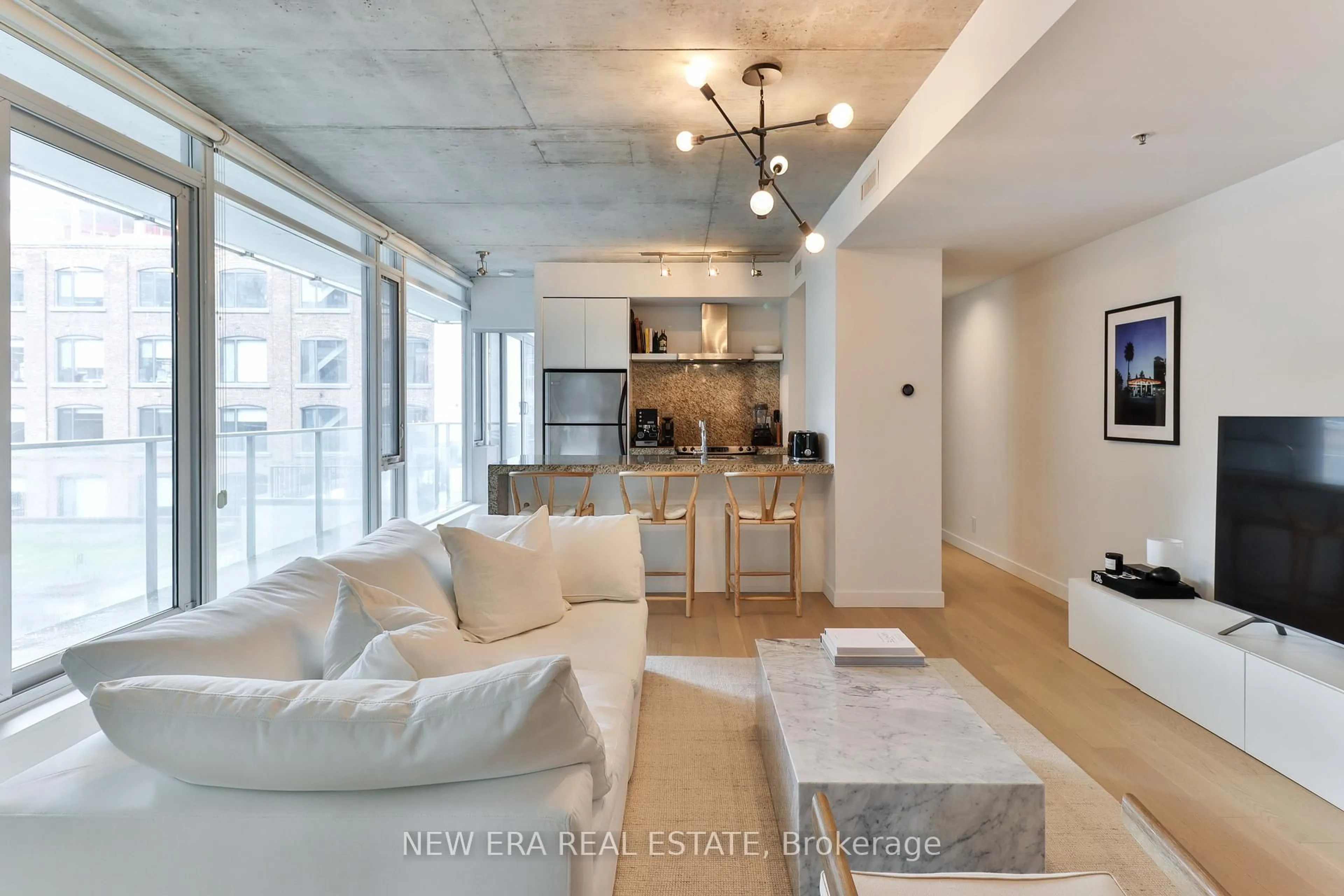 Living room with furniture, cement floor for 75 Portland St #423, Toronto Ontario M5V 2M9