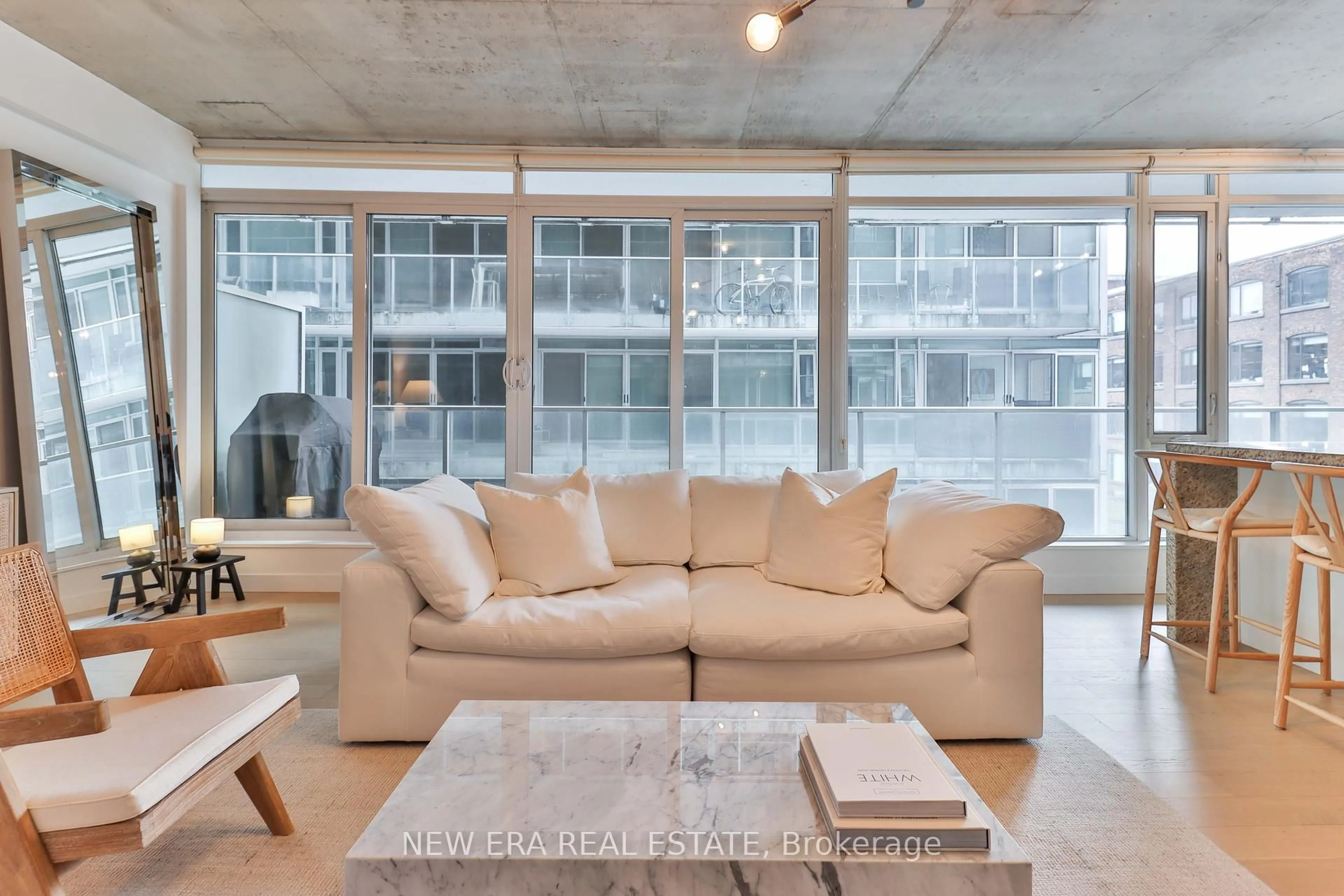 Living room with furniture, cement floor for 75 Portland St #423, Toronto Ontario M5V 2M9