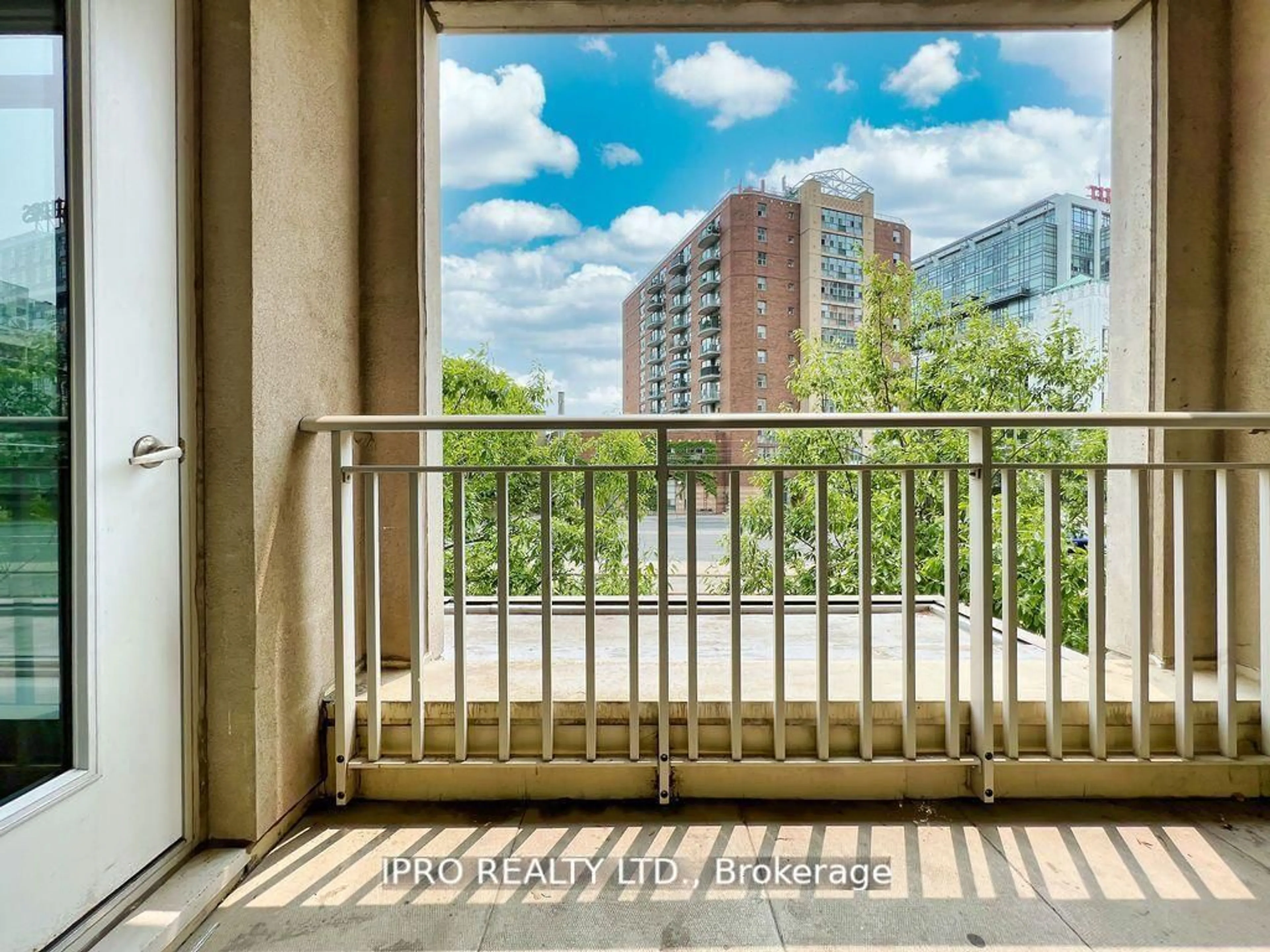 Balcony in the apartment, city buildings view from balcony for 21 Grand Magazine St #217, Toronto Ontario M5V 1B4