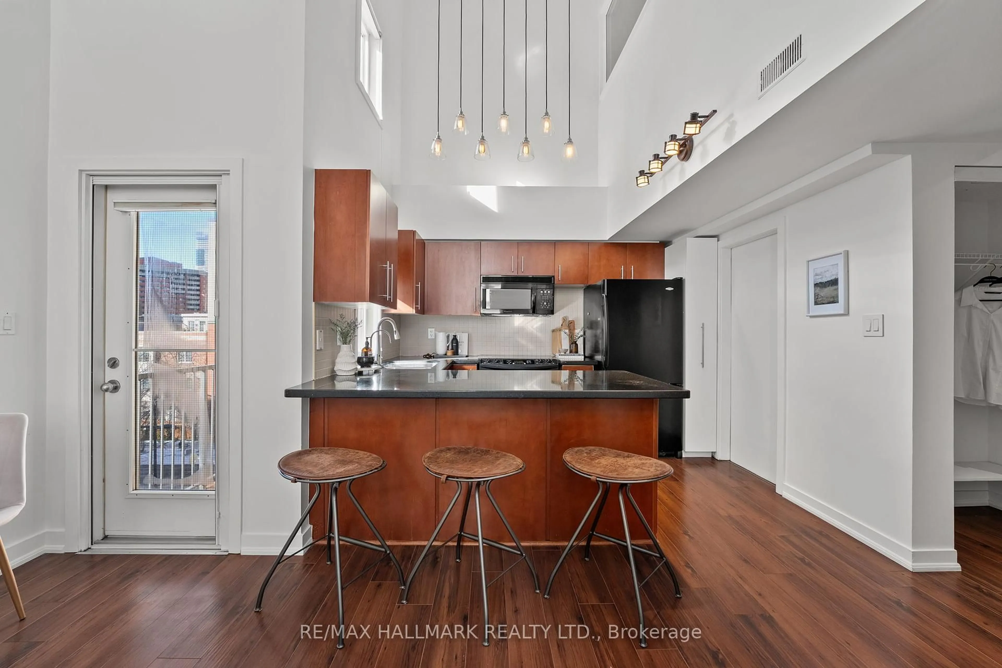 Open concept kitchen, wood/laminate floor for 21 Earl St #302, Toronto Ontario M4Y 3C8