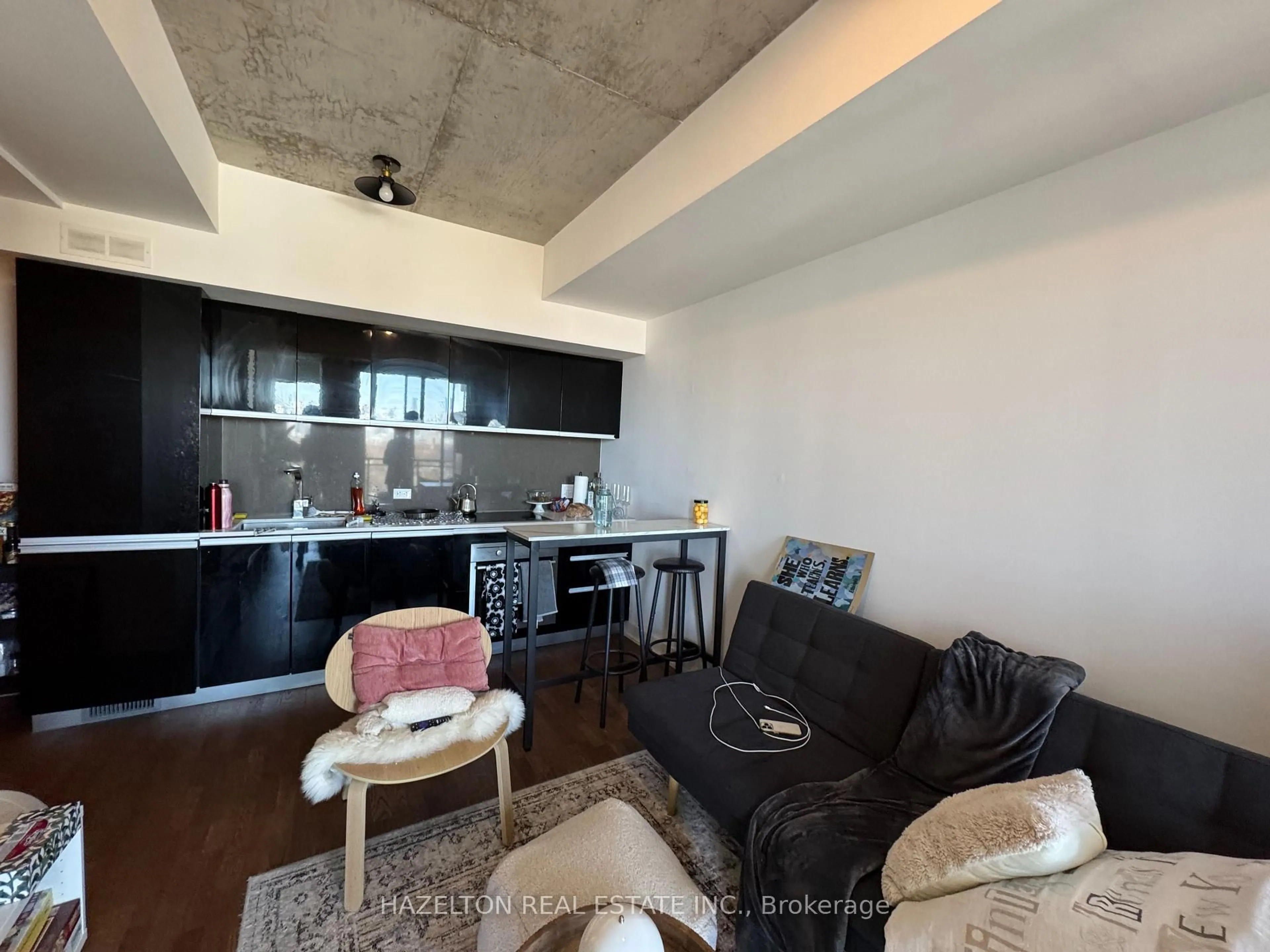 Open concept kitchen, cement floor for 20 Minowan Miikan Lane #1029, Toronto Ontario M6J 0E5