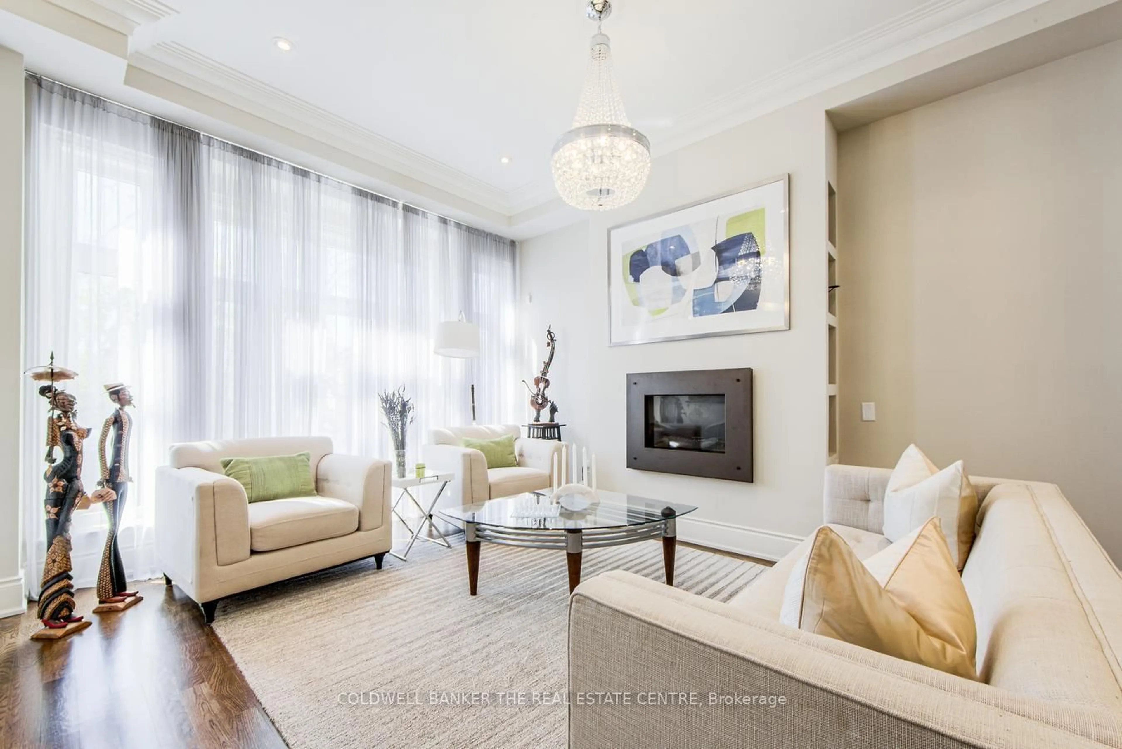 Living room with furniture, wood/laminate floor for 394 Balliol St, Toronto Ontario M4S 1E2