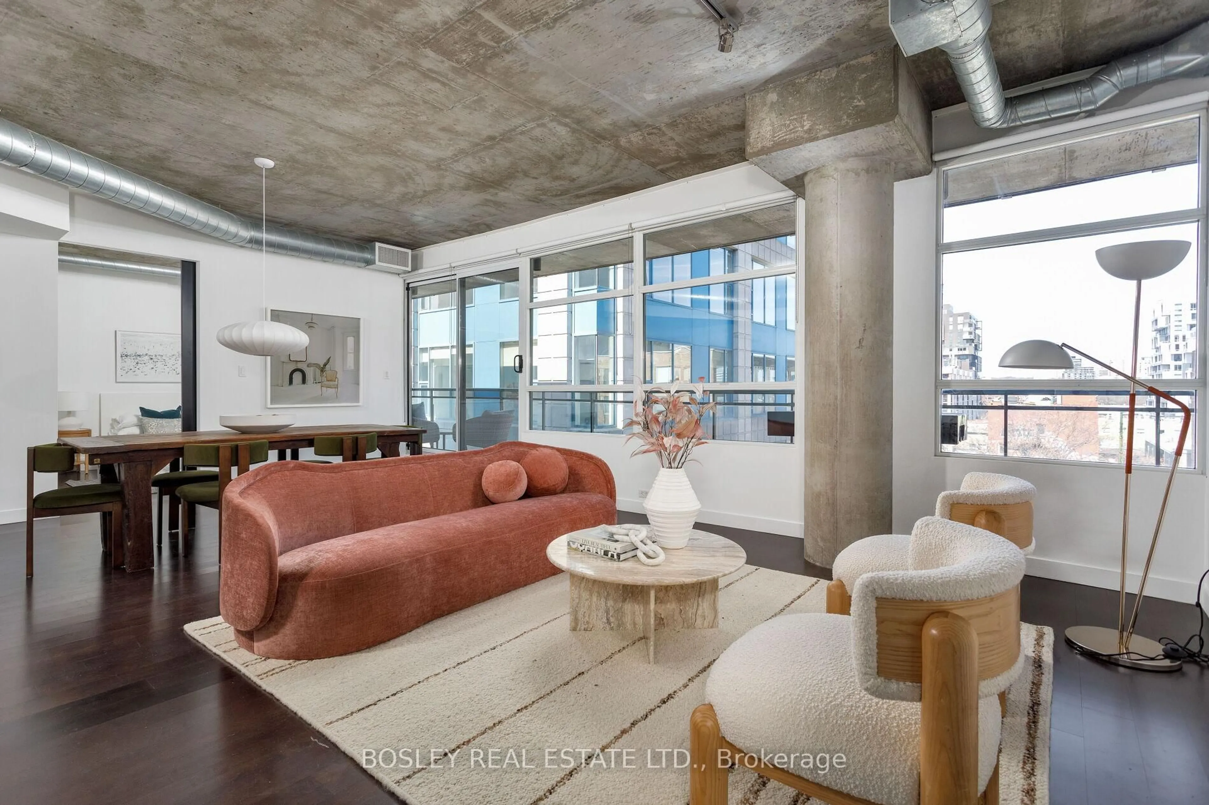 Living room with furniture, cement floor for 42 Camden St #703, Toronto Ontario M5V 1V1