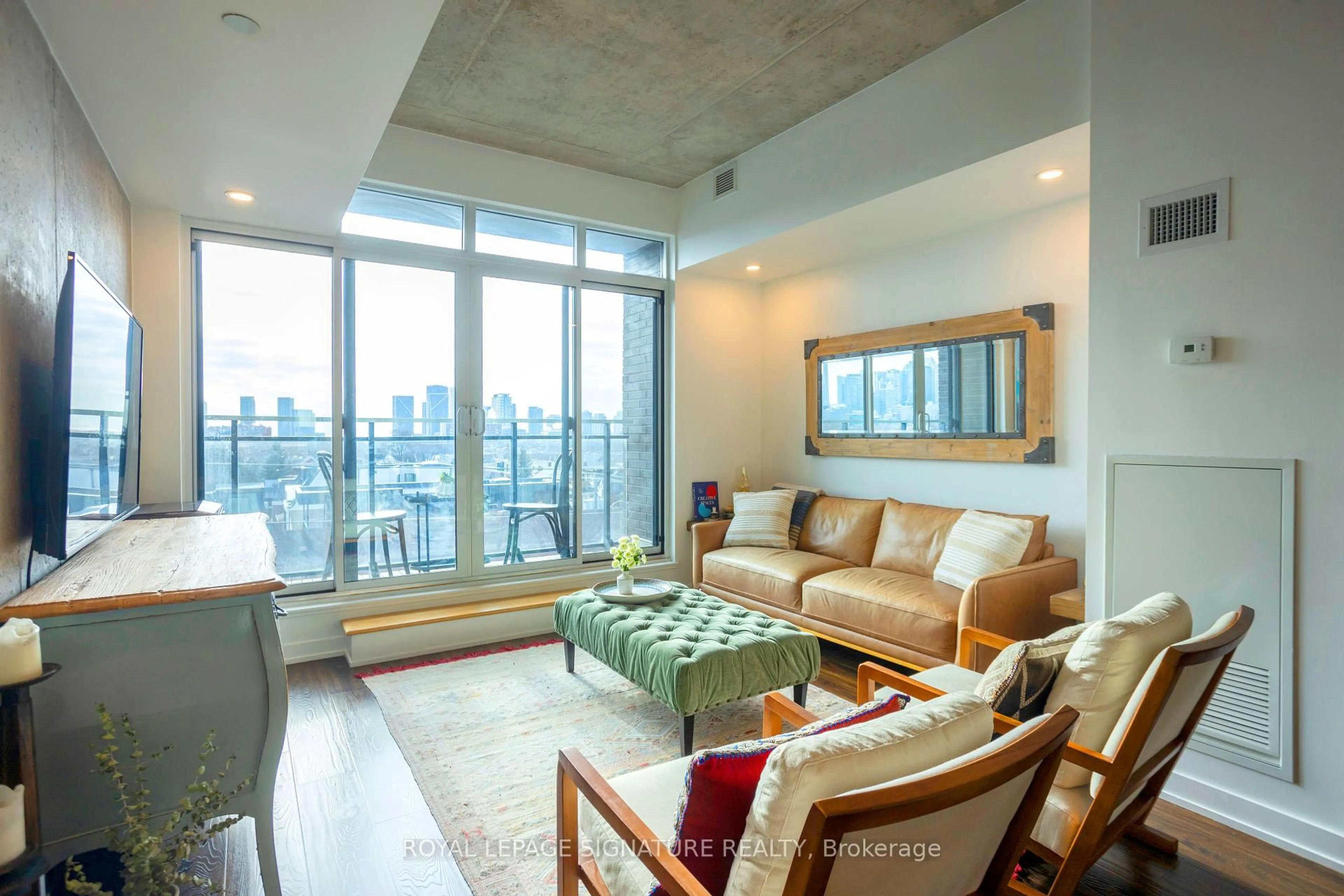 Living room with furniture, cement floor for 205 Manning Ave #408, Toronto Ontario M6J 0E2