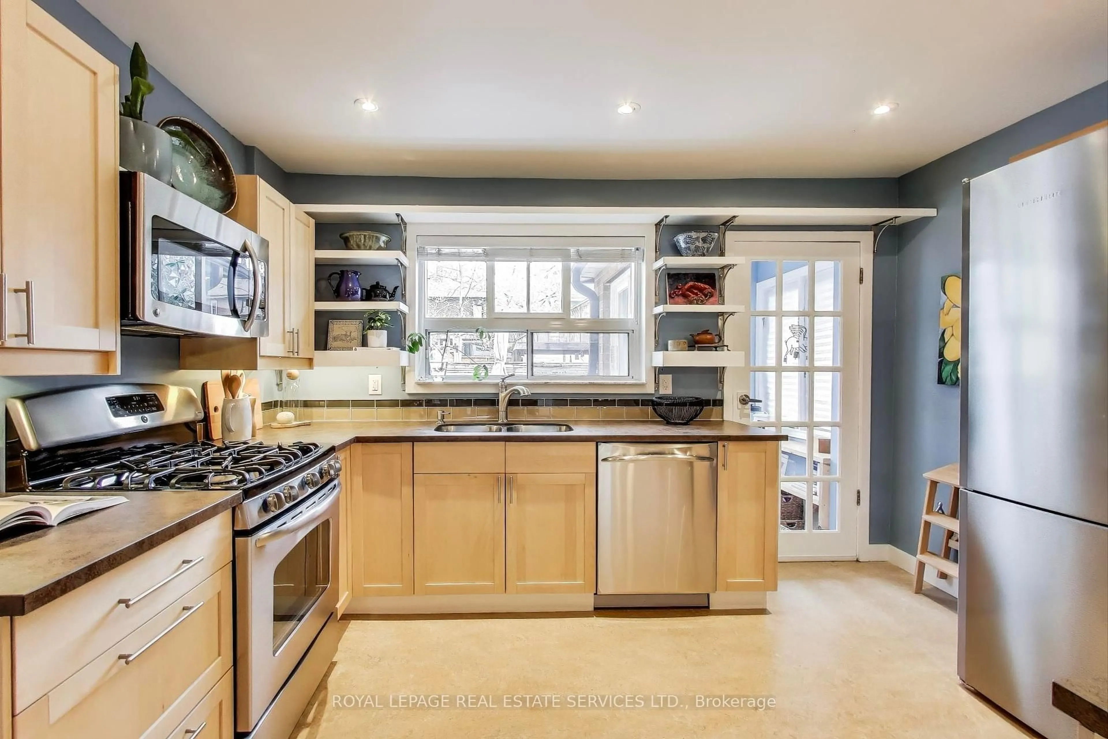 Open concept kitchen, ceramic/tile floor for 99 Winnett Ave, Toronto Ontario M6C 3L4
