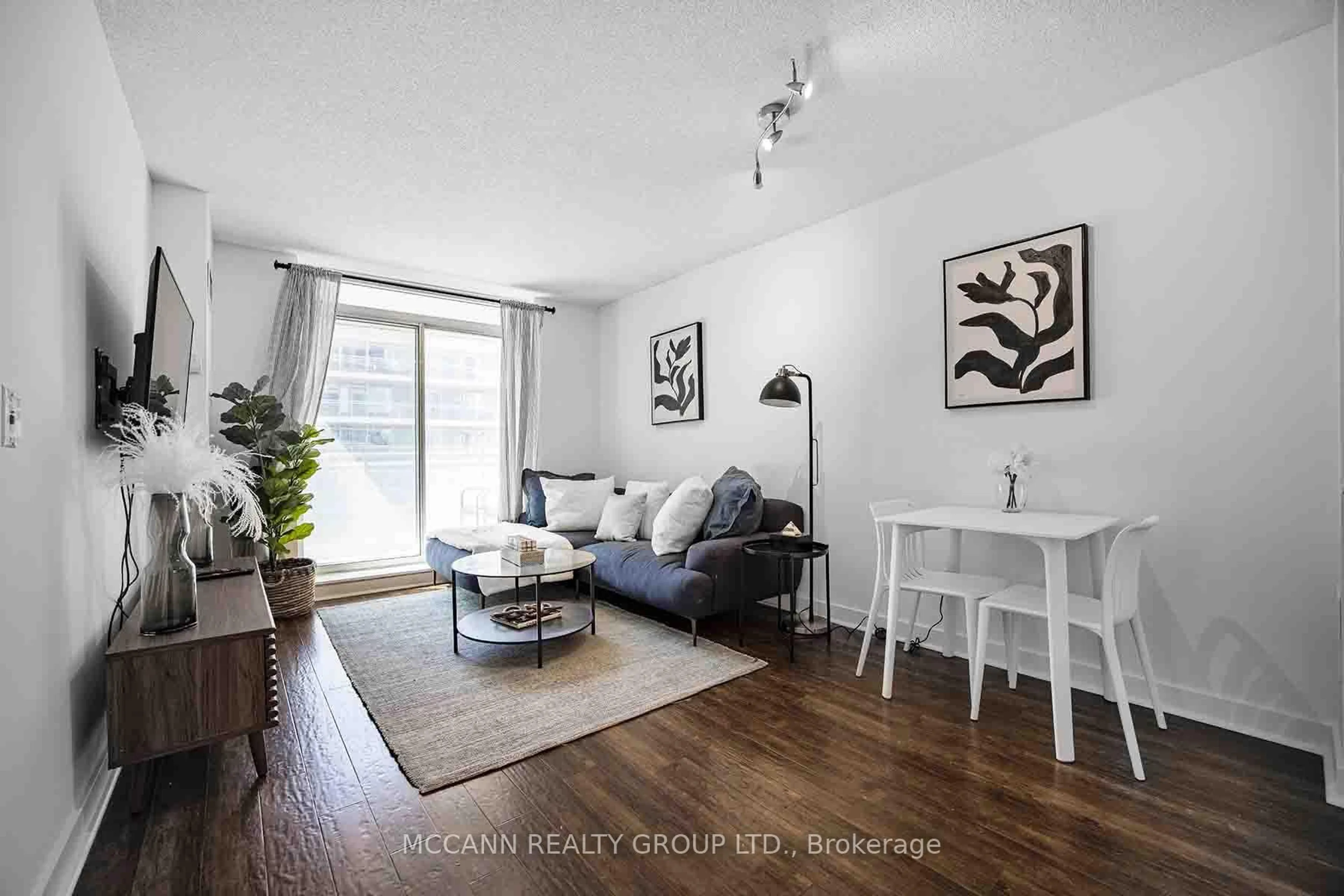 Living room with furniture, wood/laminate floor for 50 Lynn Williams St #304, Toronto Ontario M6K 3R9