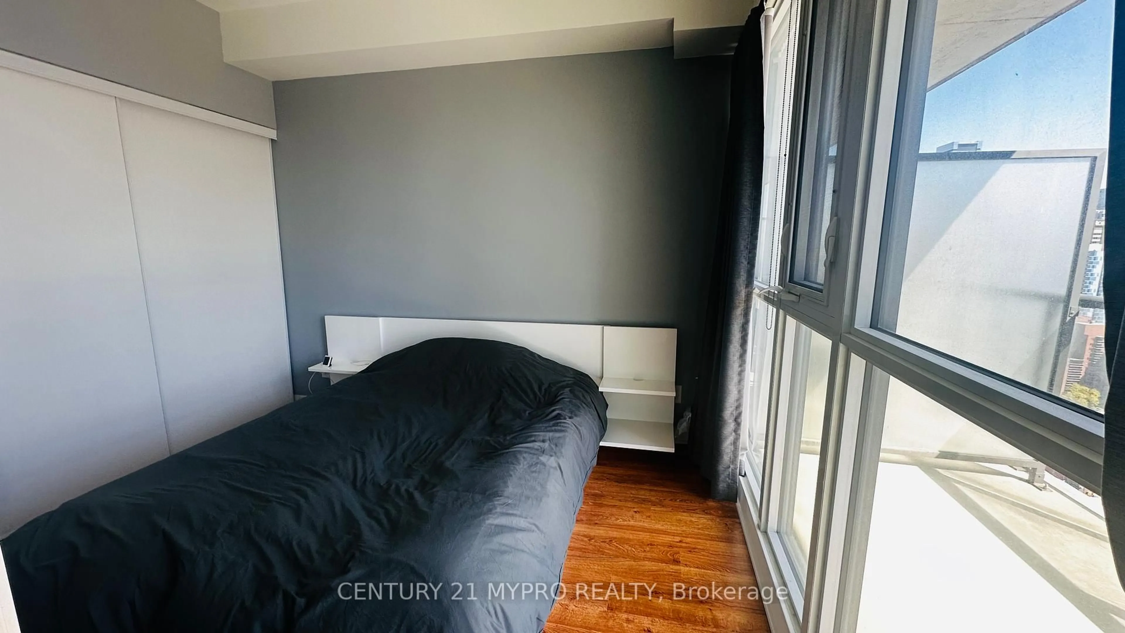 Bedroom with bed, wood/laminate floor for 290 Adelaide St #2708, Toronto Ontario M5V 0P3