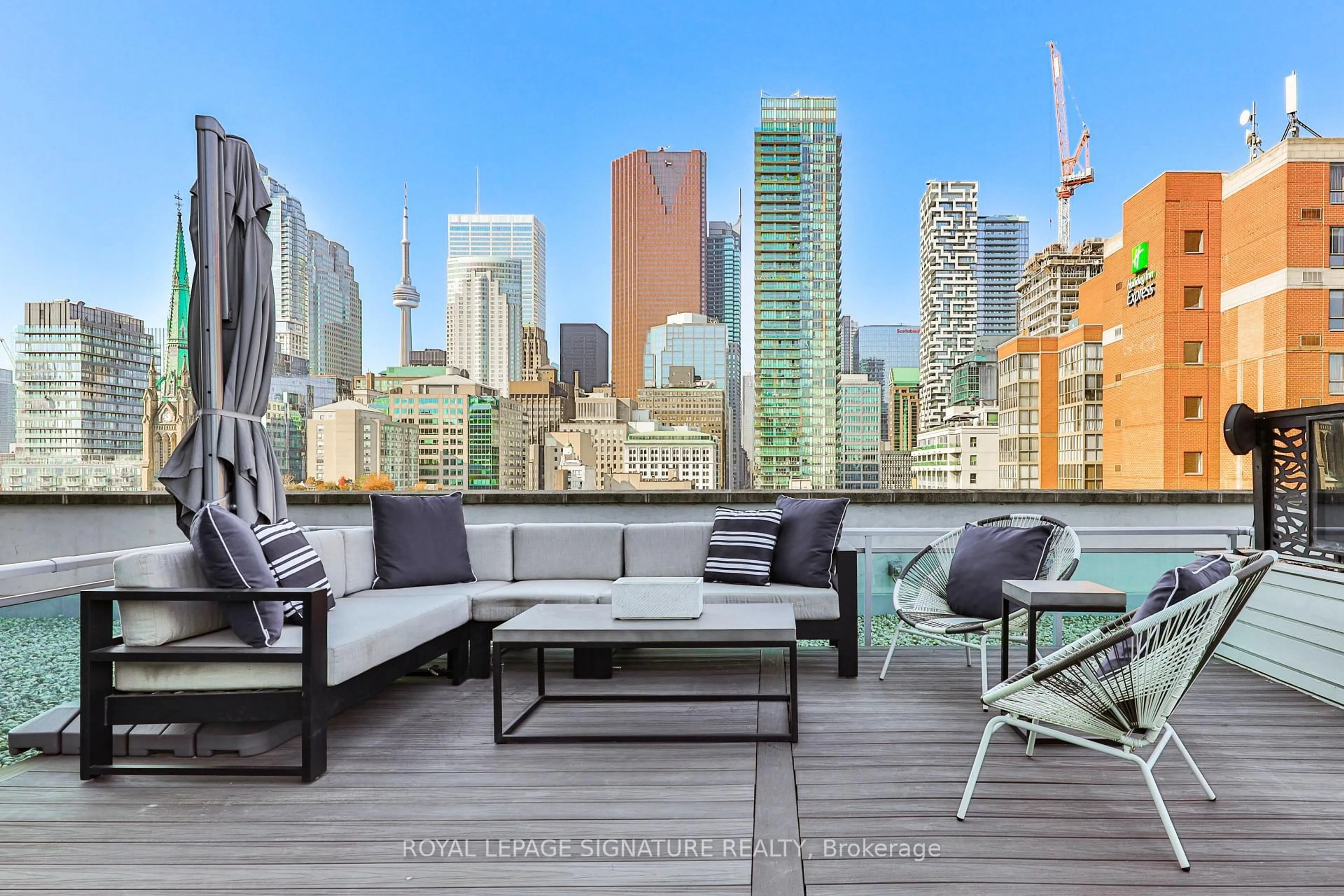 Patio, city buildings view from balcony for 112 George St #902, Toronto Ontario M5A 2M5