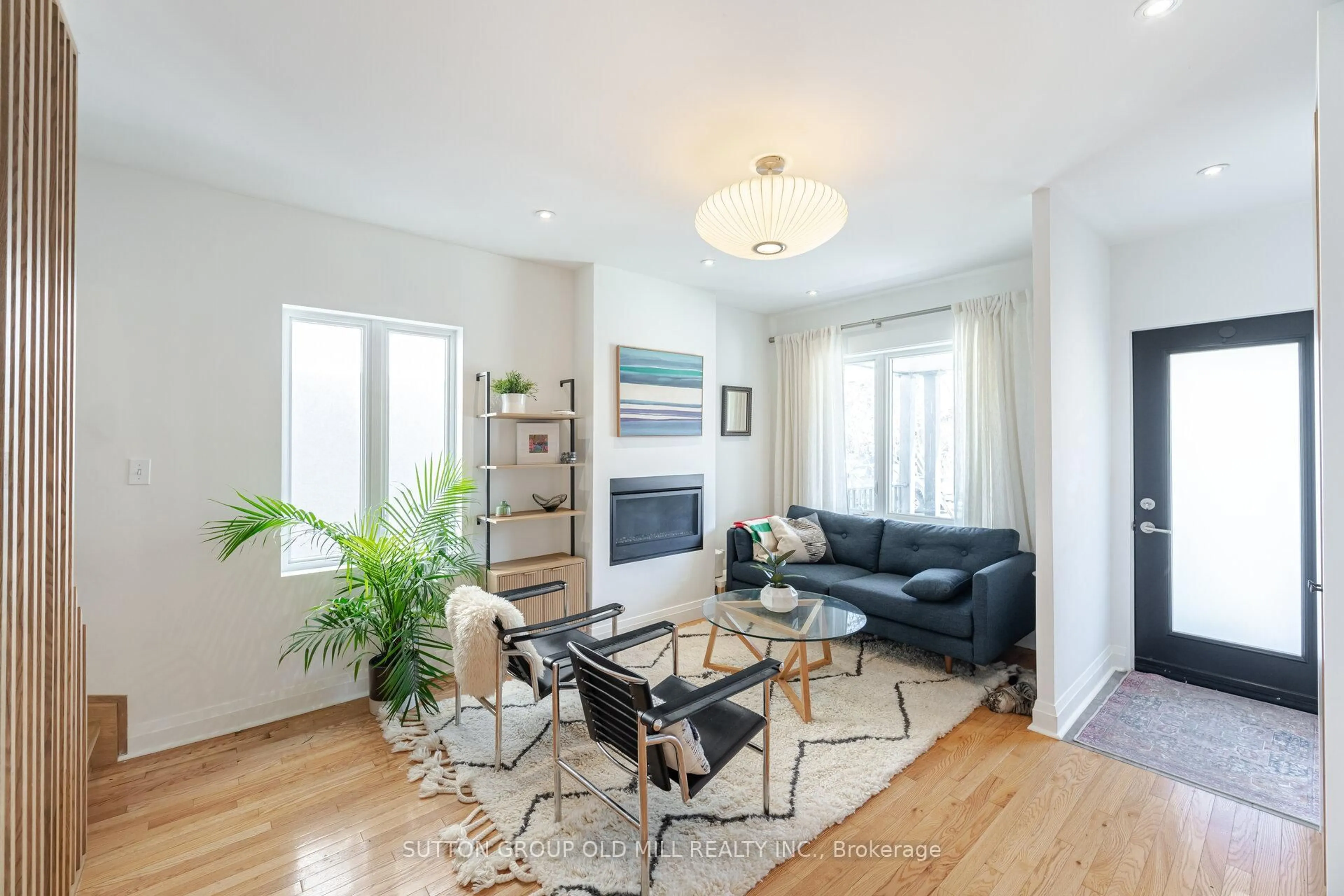 Living room with furniture, wood/laminate floor for 46 Holland Park Ave, Toronto Ontario M6C 1M3