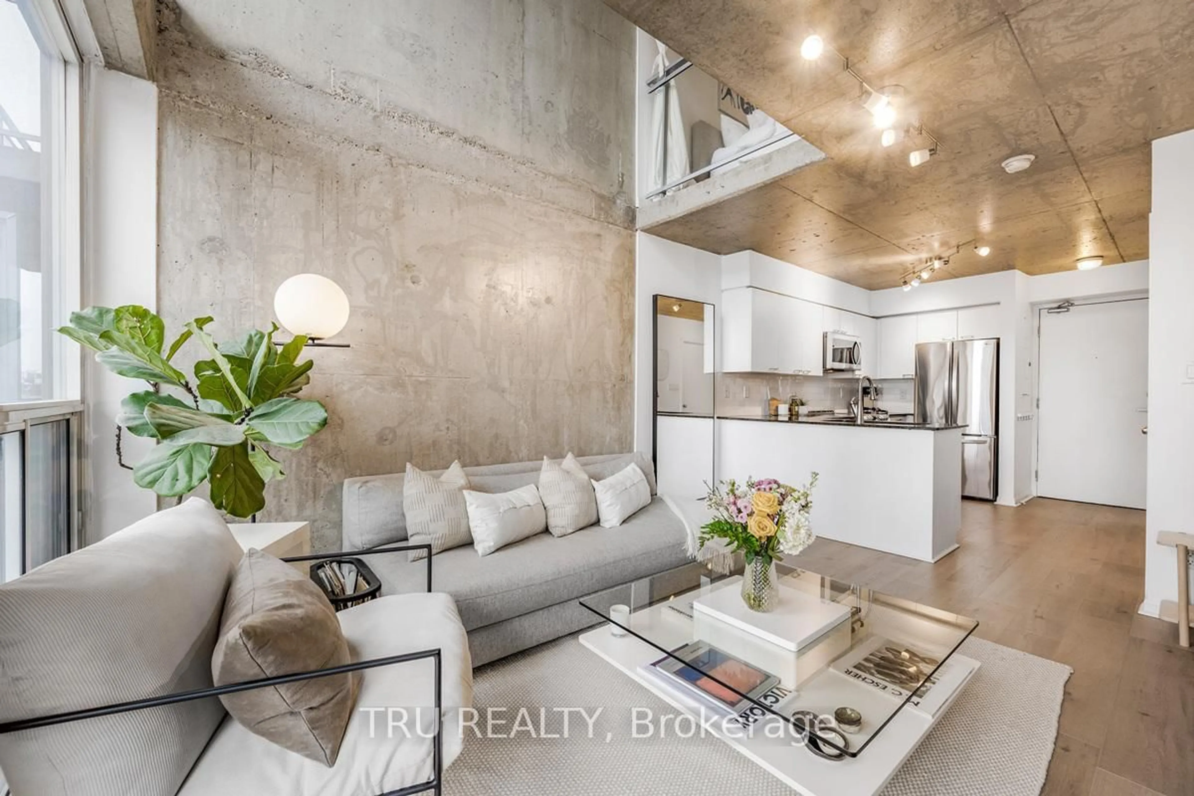 Open concept kitchen, cement floor for 1029 King St #841, Toronto Ontario M6K 3M9