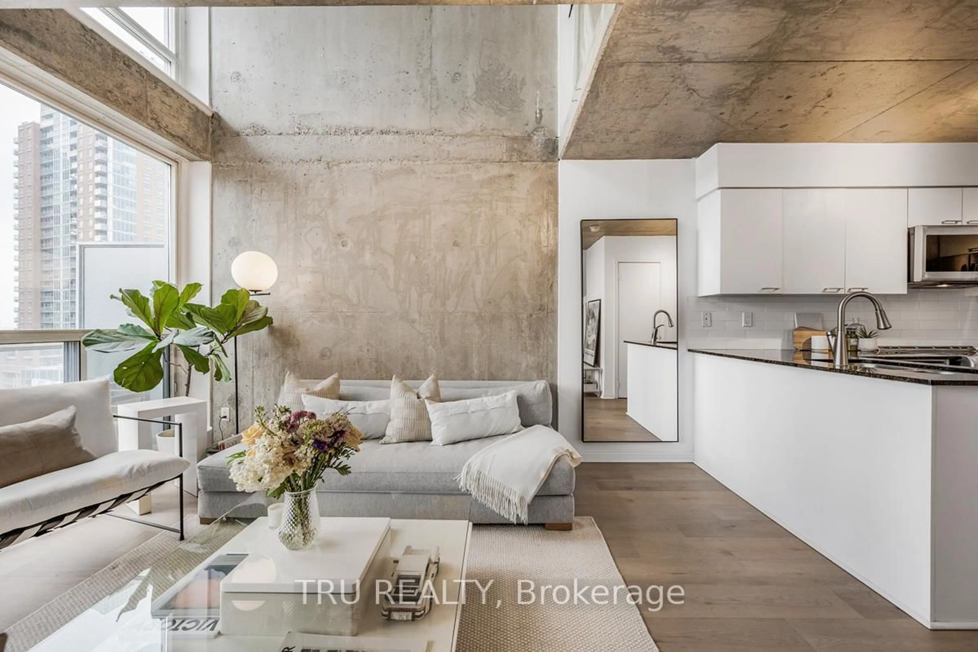 Open concept kitchen, cement floor for 1029 King St #841, Toronto Ontario M6K 3M9