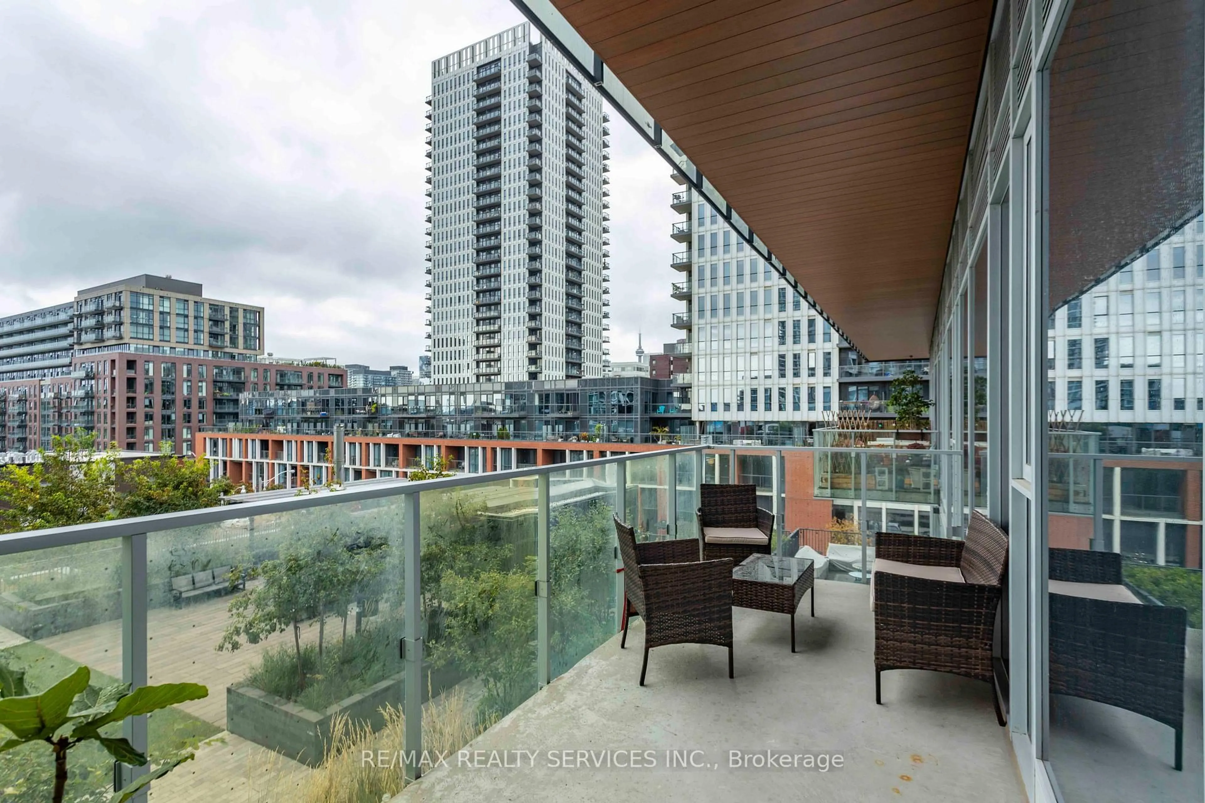 Patio, city buildings view from balcony for 20 Tubman Ave #403, Toronto Ontario M5A 0M8