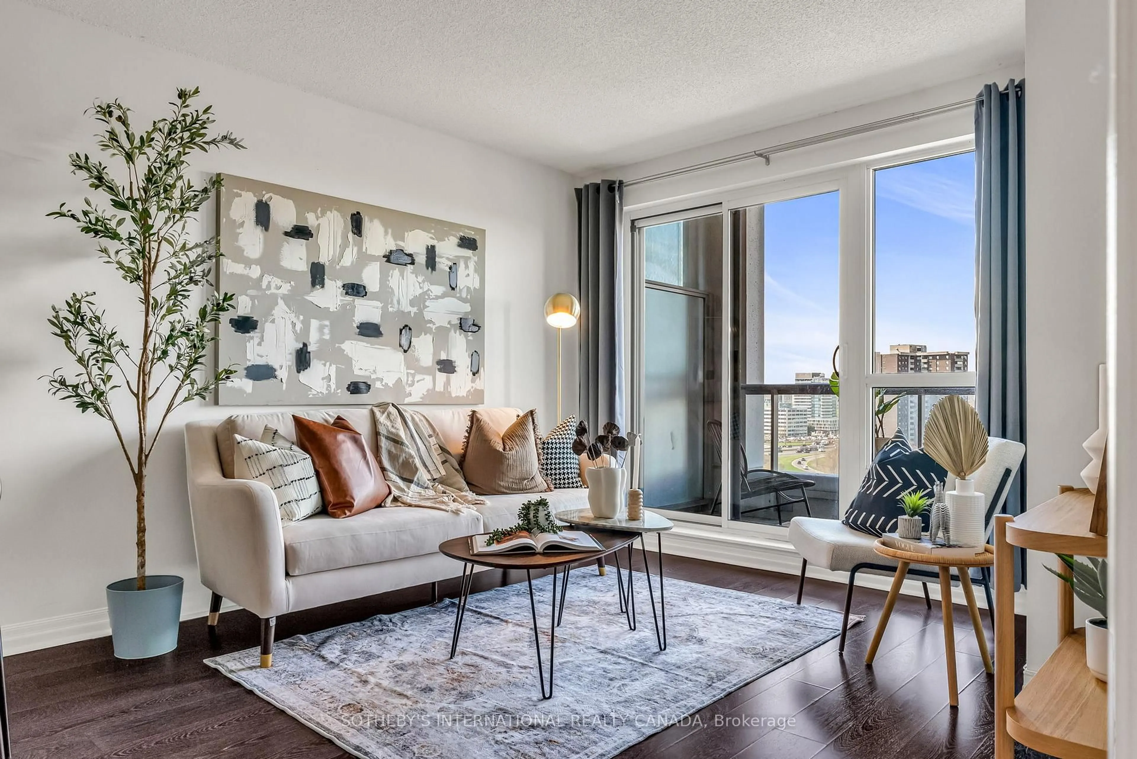 Living room with furniture, wood/laminate floor for 30 Herons Hill Way #1403, Toronto Ontario M2J 0A7