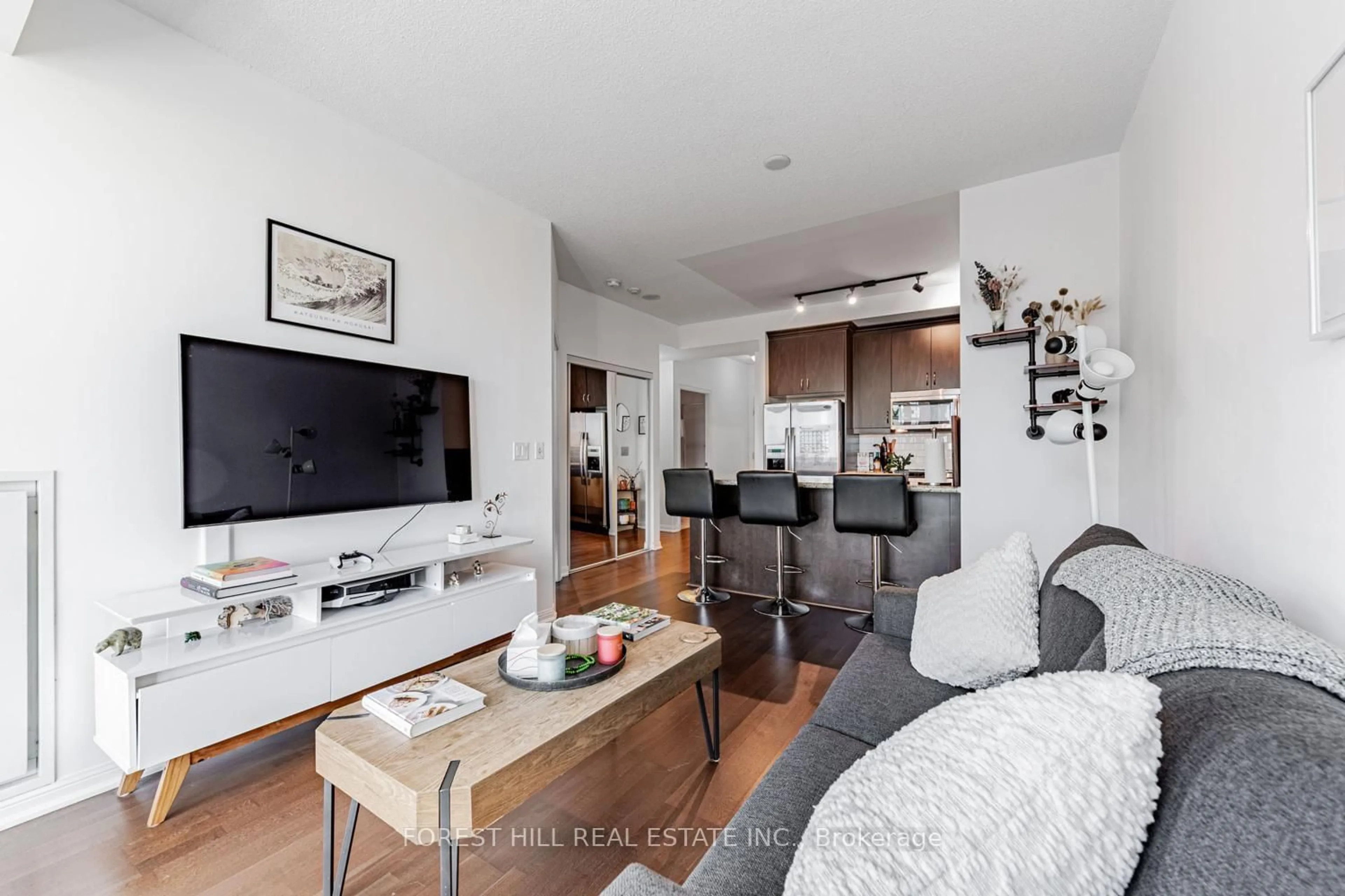 Living room with furniture, wood/laminate floor for 21 Grand Magazine St #816, Toronto Ontario M5V 1B5