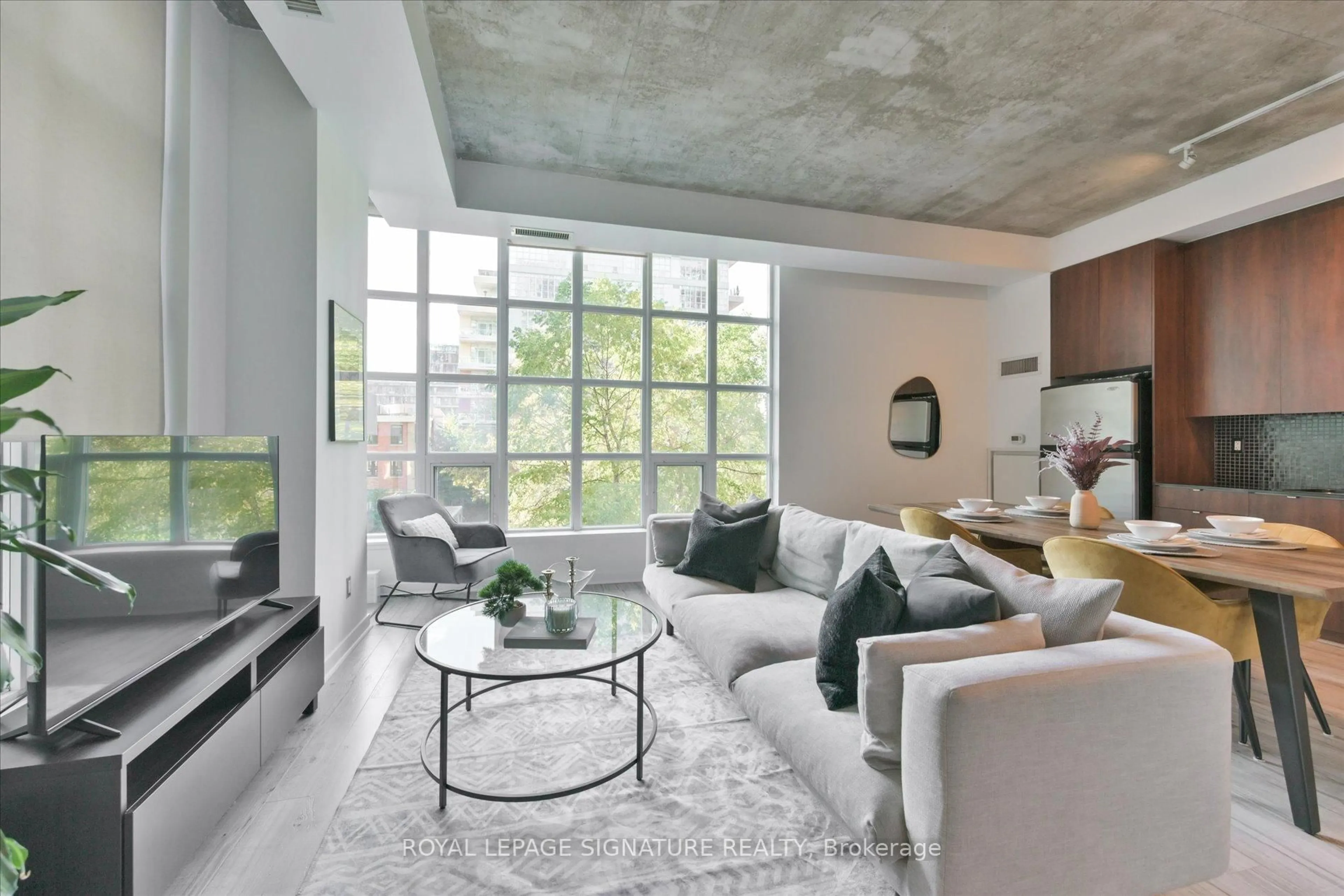 Living room with furniture, cement floor for 23 Brant St #305, Toronto Ontario M5V 2L5