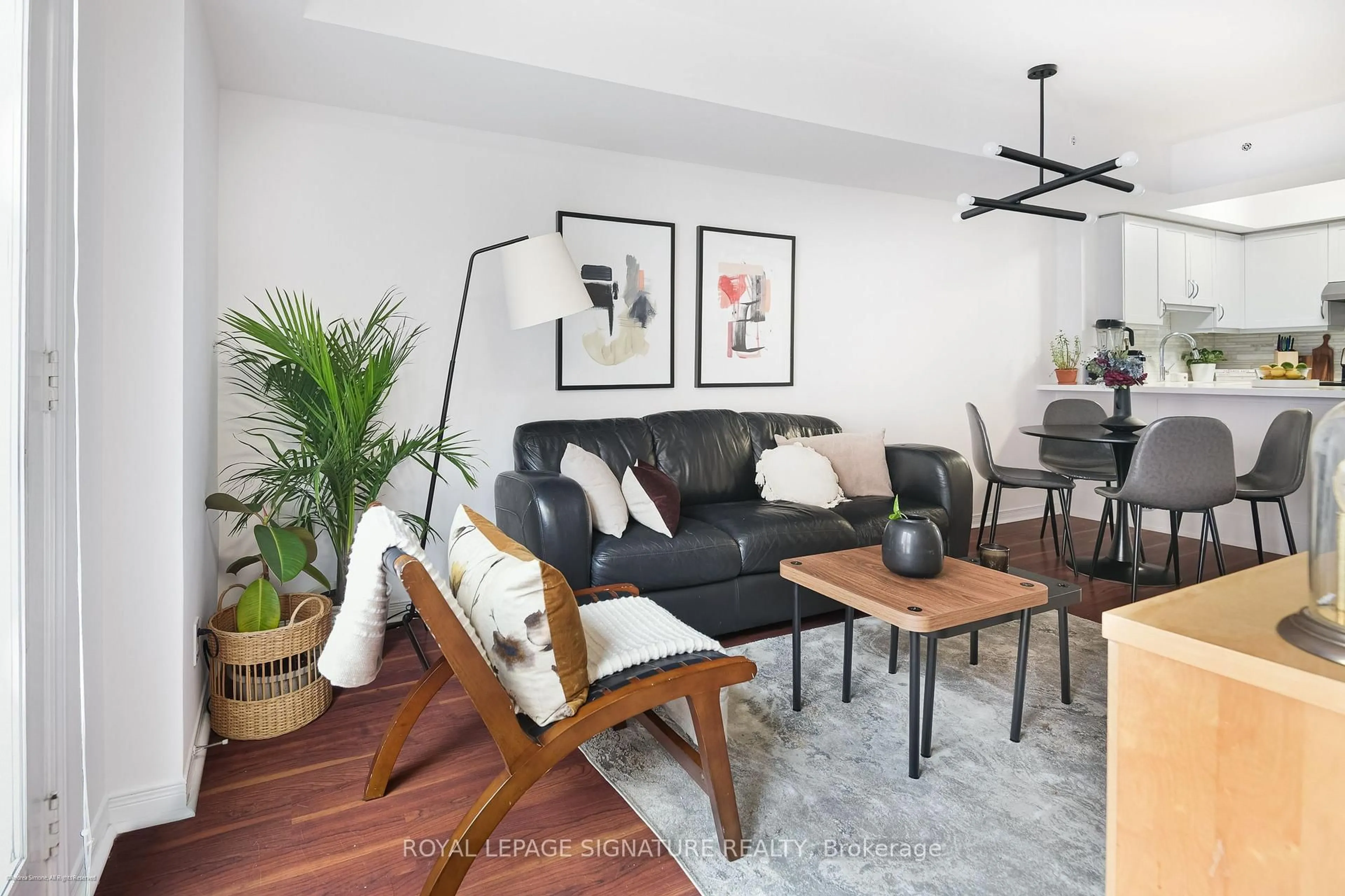 Living room with furniture, wood/laminate floor for 12 Sudbury St #3004, Toronto Ontario M6J 3W7