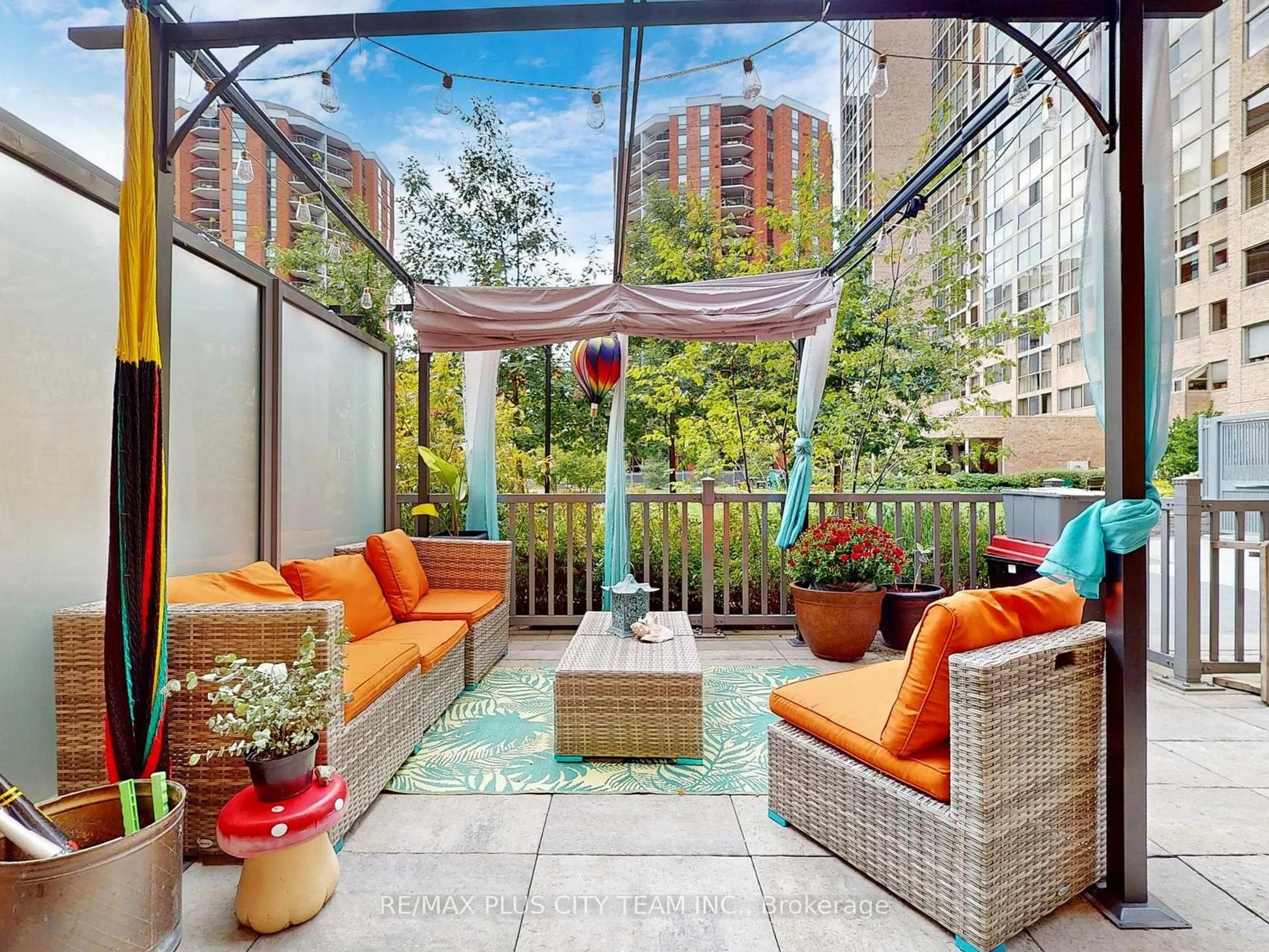 Patio, city buildings view from balcony for 60 Homewood Ave #TH 112, Toronto Ontario M4Y 2X4