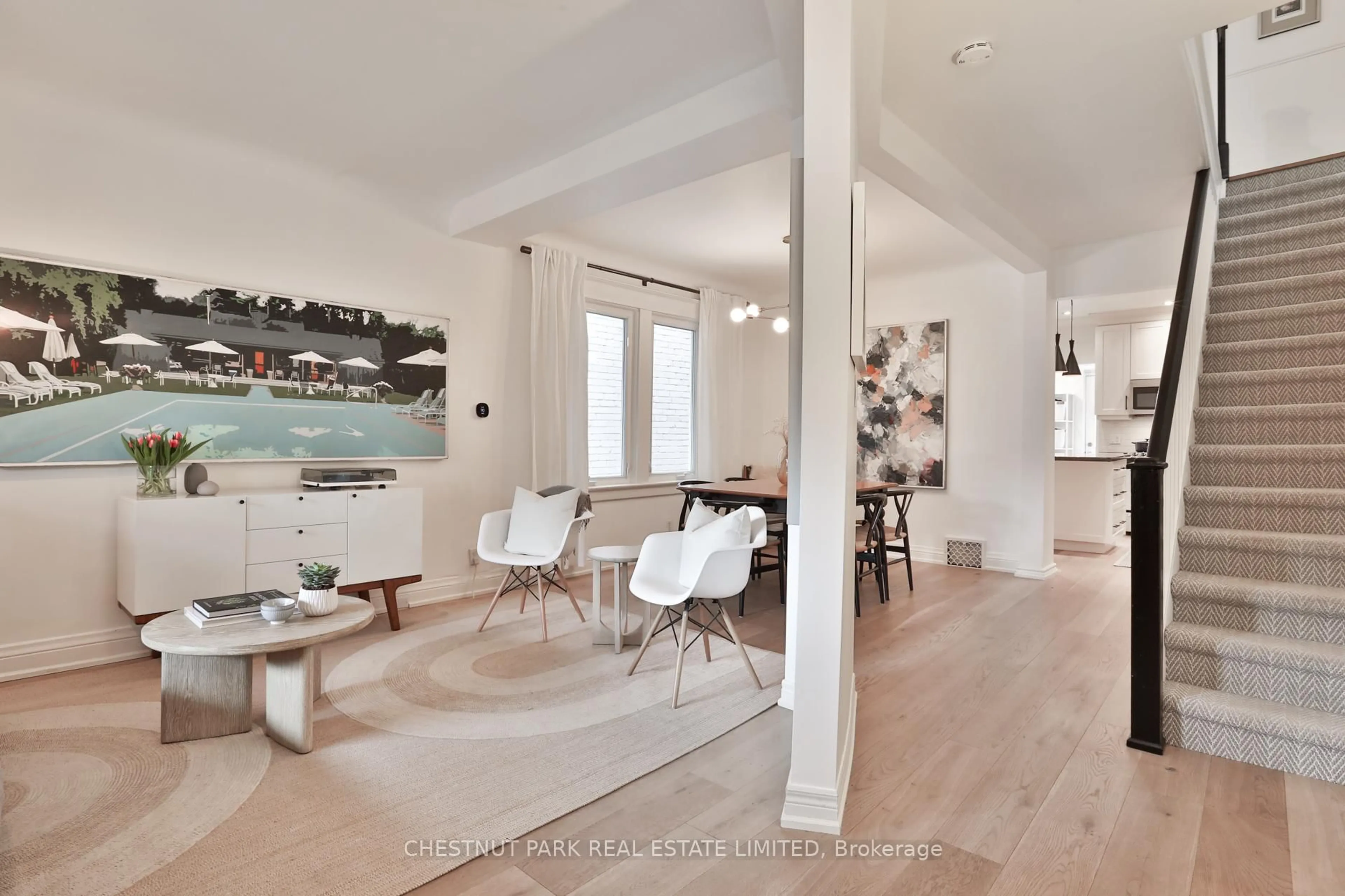 Open concept kitchen, wood/laminate floor for 132 Tyrrel Ave, Toronto Ontario M6G 2G5
