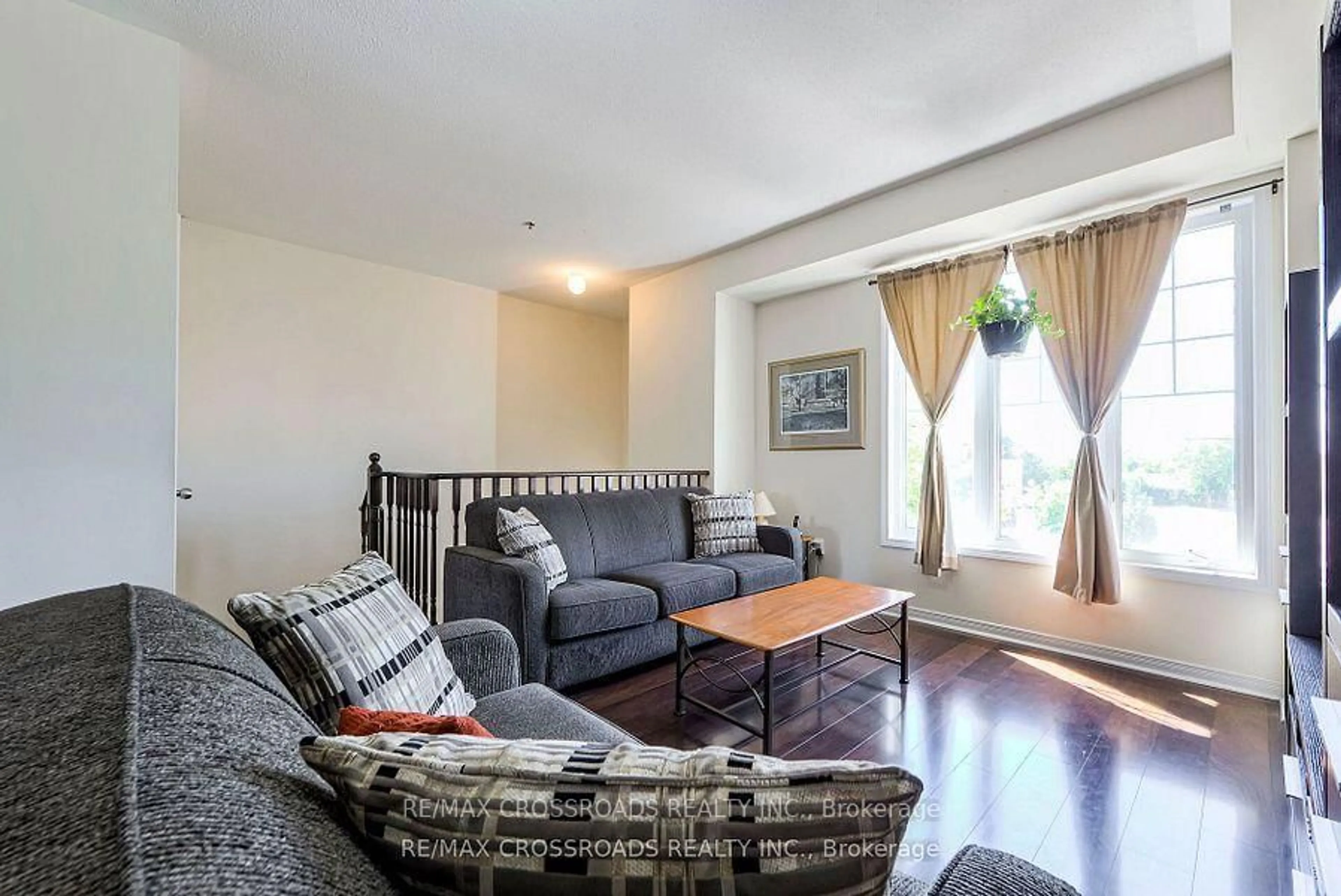 Living room with furniture, wood/laminate floor for 25D Hobson Ave, Toronto Ontario M4A 0A4