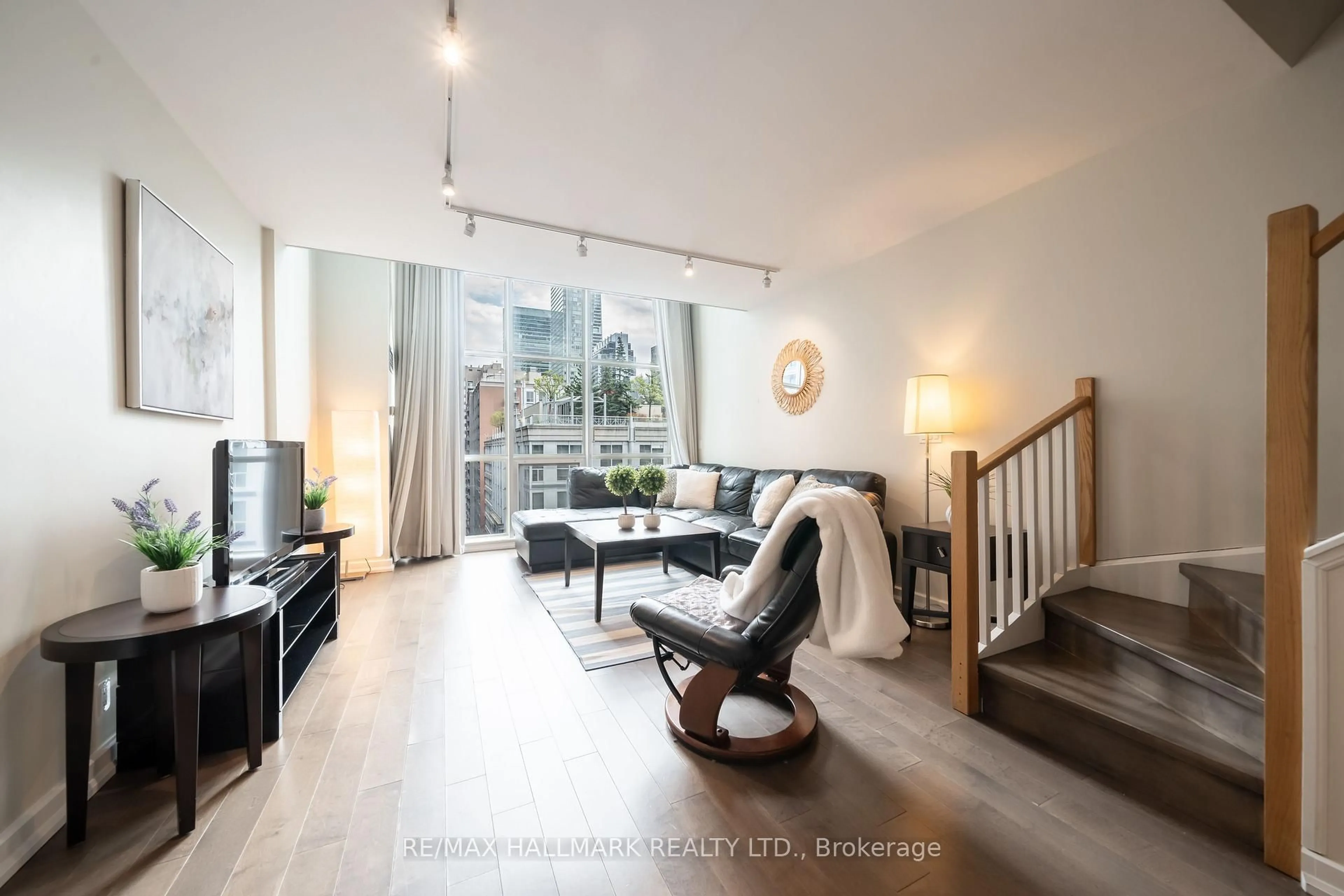 Living room with furniture, wood/laminate floor for 36 Blue Jays Way #1107, Toronto Ontario M5V 3T3