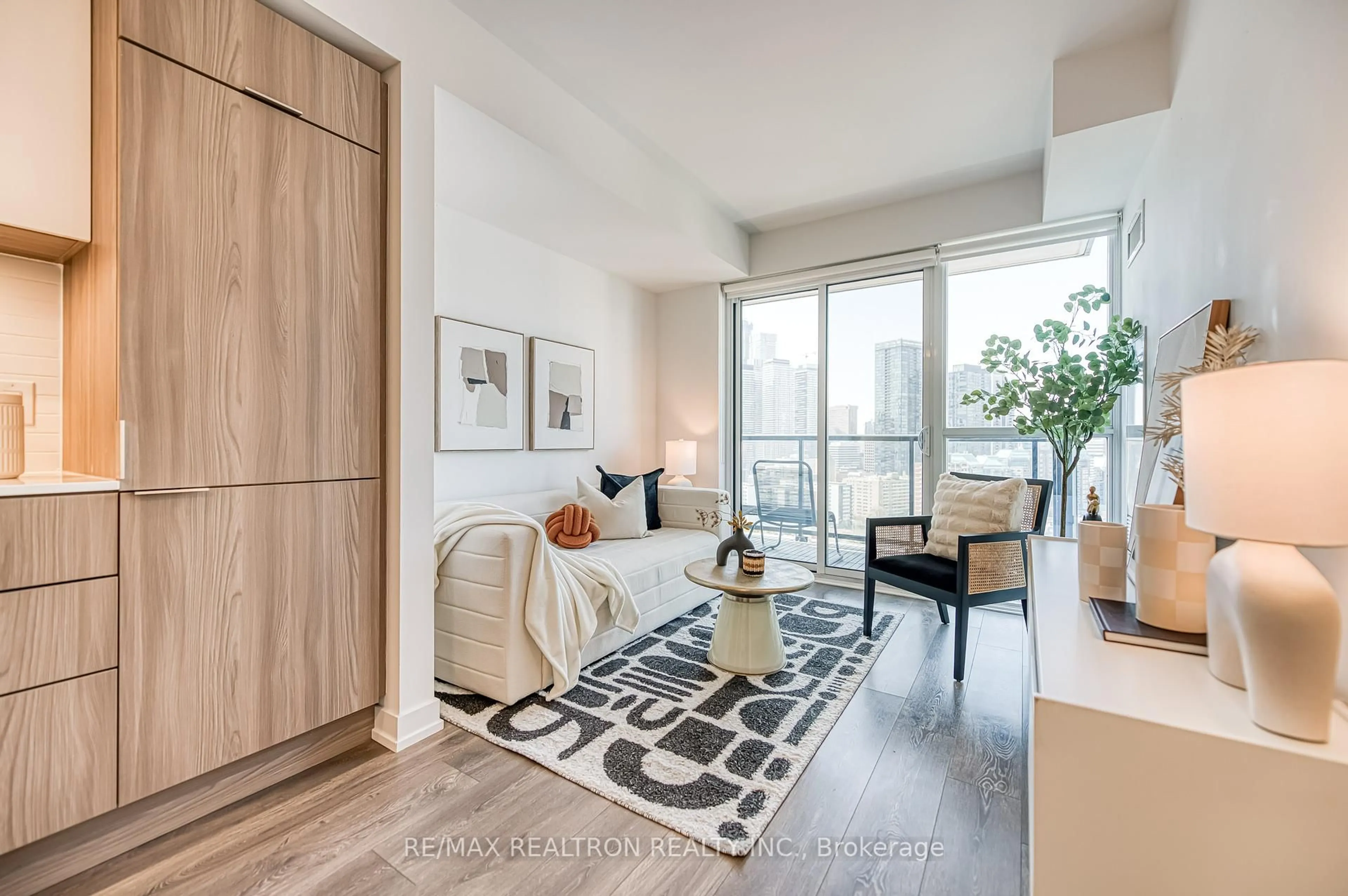 Living room with furniture, wood/laminate floor for 159 Wellesley St #2210, Toronto Ontario M4Y 0H5
