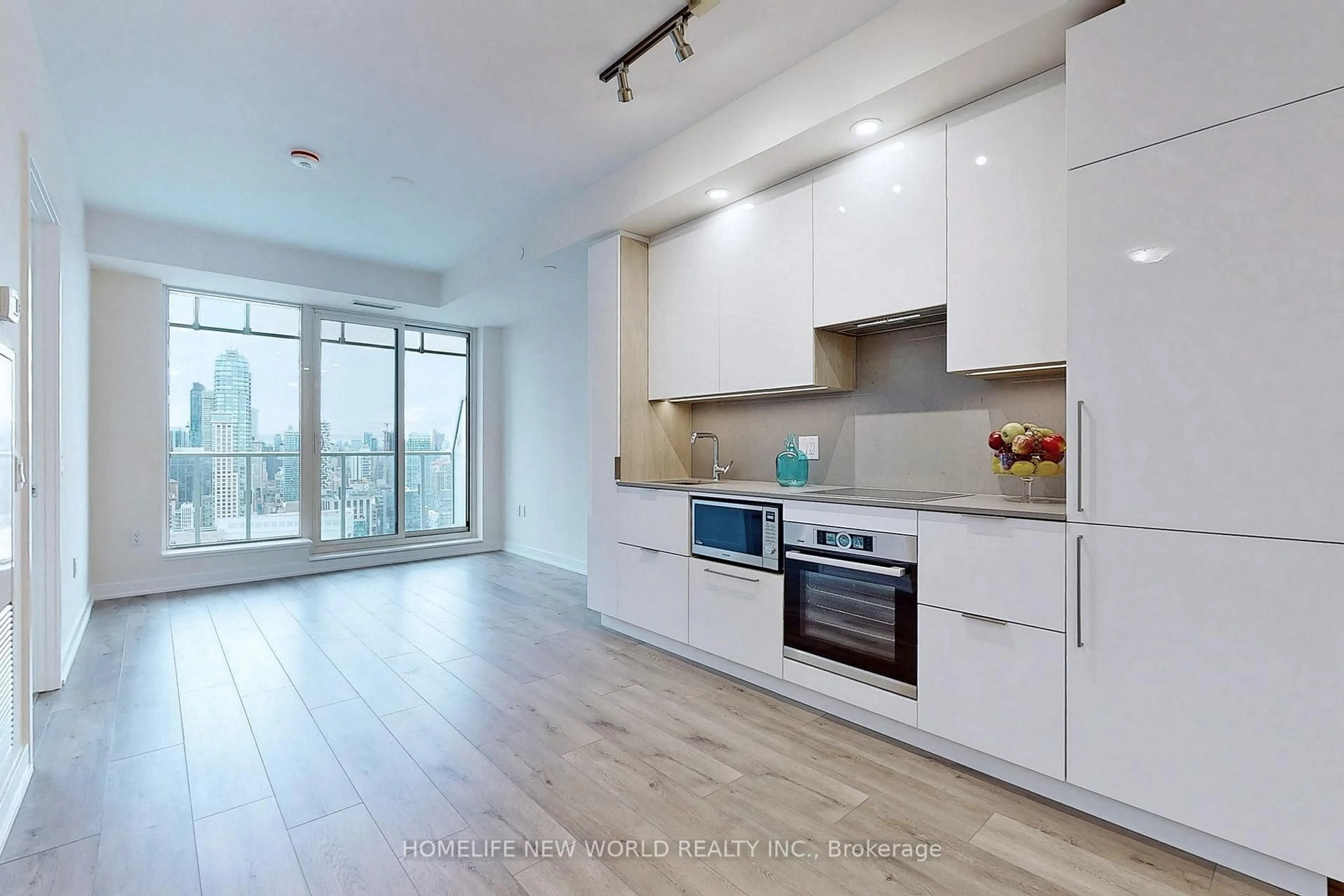 Open concept kitchen, wood/laminate floor for 28 Freeland St #4106, Toronto Ontario M5E 0E3