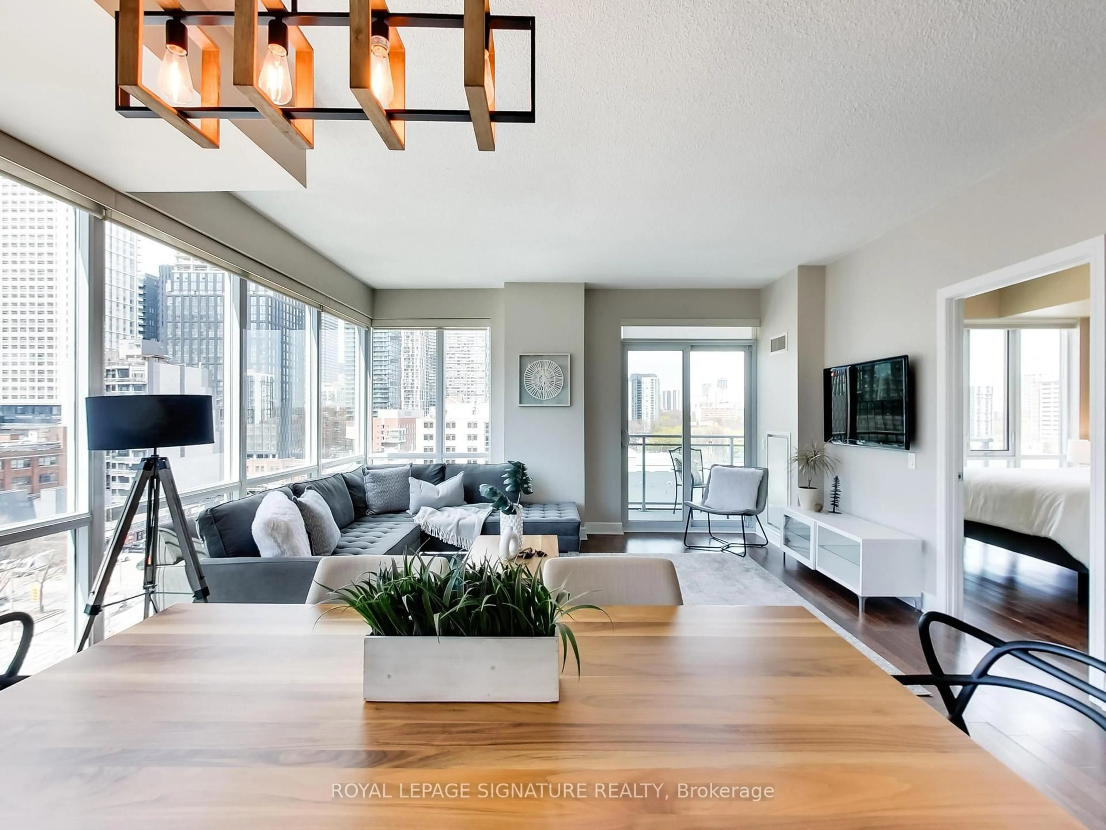 Living room with furniture, wood/laminate floor for 116 George St #905, Toronto Ontario M5A 3S2