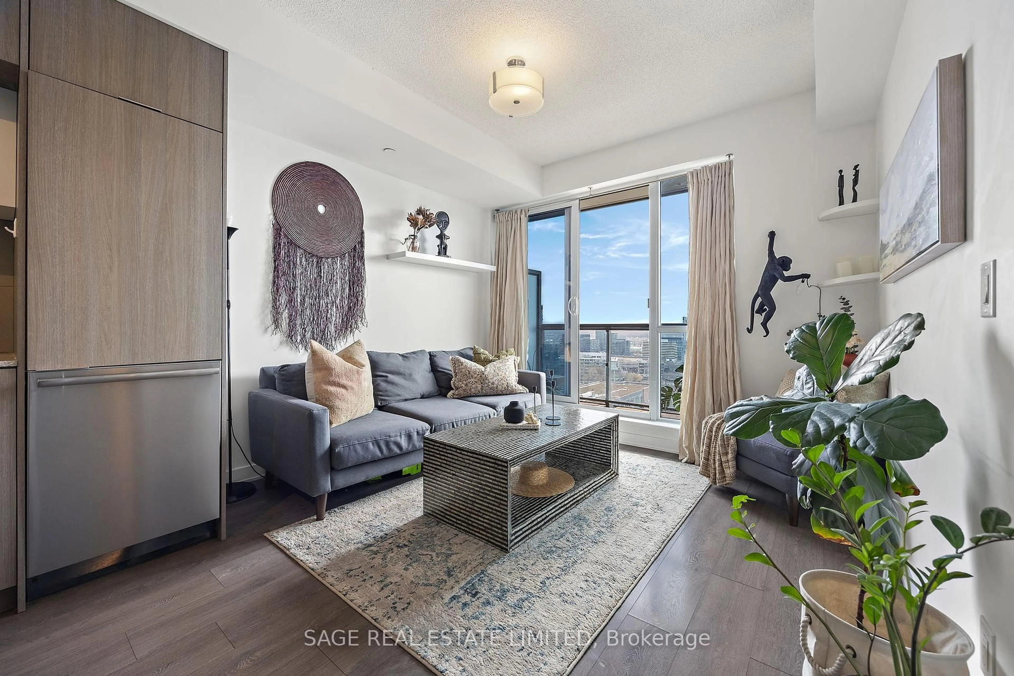Living room with furniture, wood/laminate floor for 55 Regent Park Blvd #1904, Toronto Ontario M5A 0C2