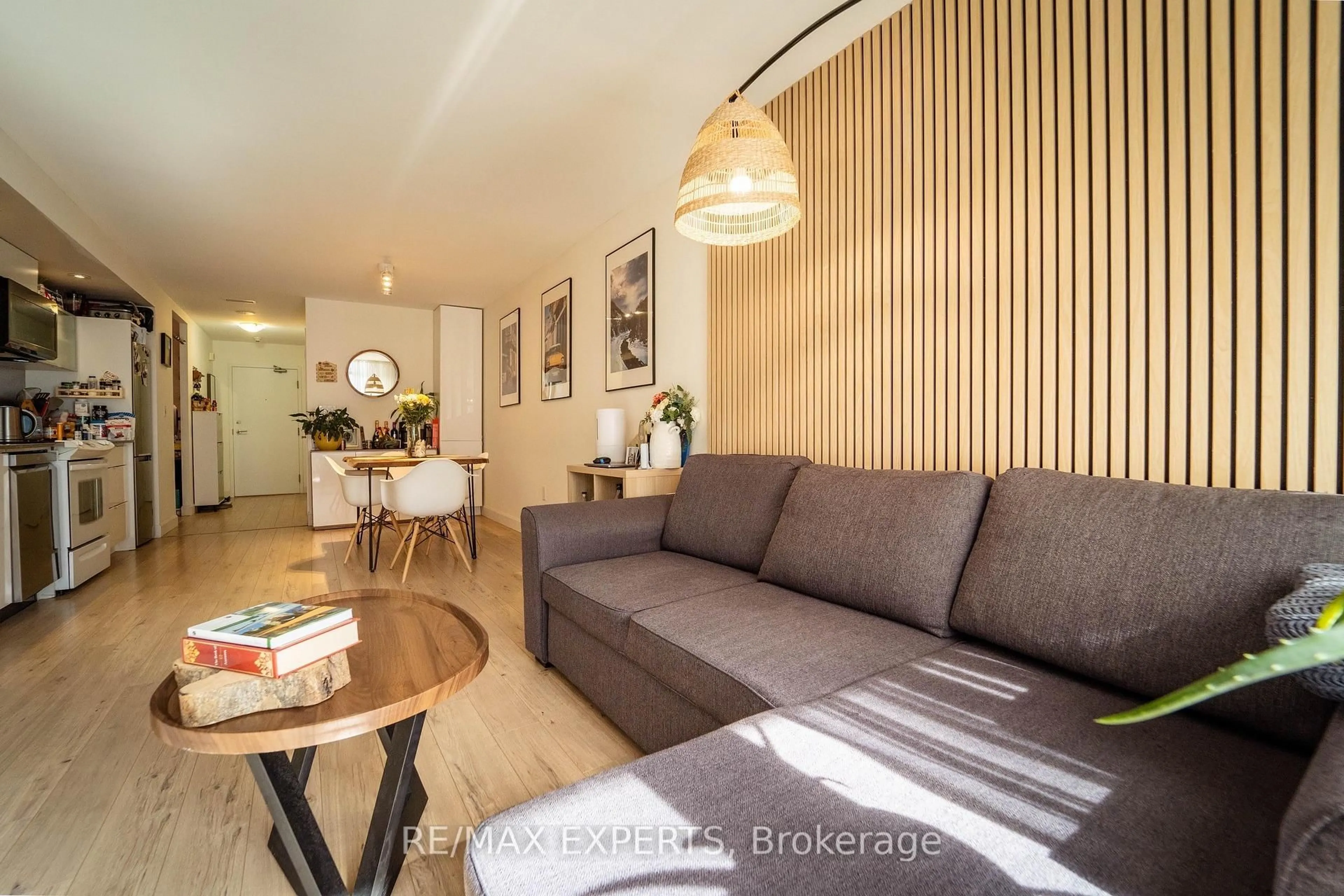 Living room with furniture, wood/laminate floor for 4 Spadina Ave #1223, Toronto Ontario M5V 3Y9