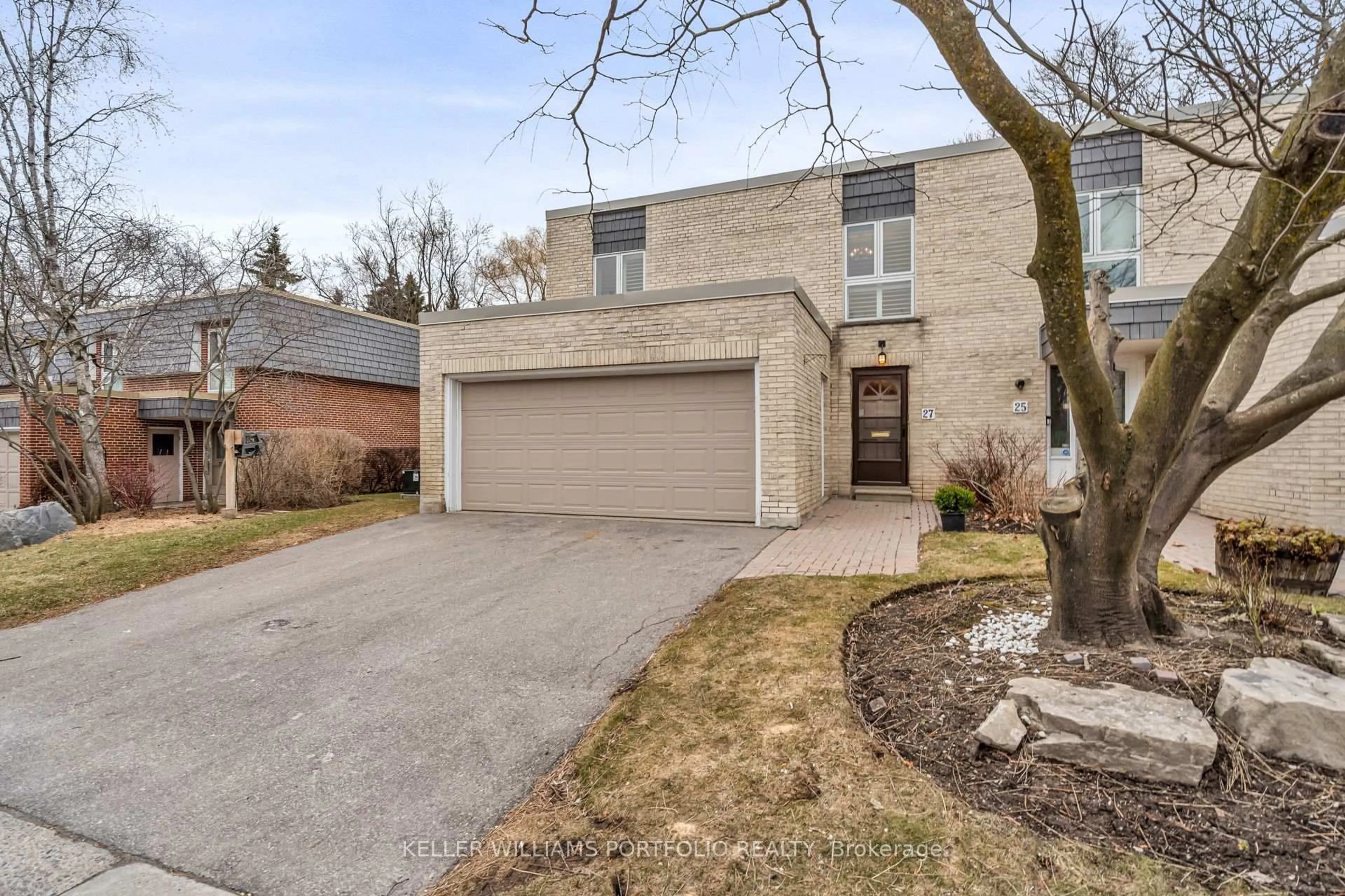 Home with brick exterior material, street for 27 Snowshoe Mill Way, Toronto Ontario M2L 1T4