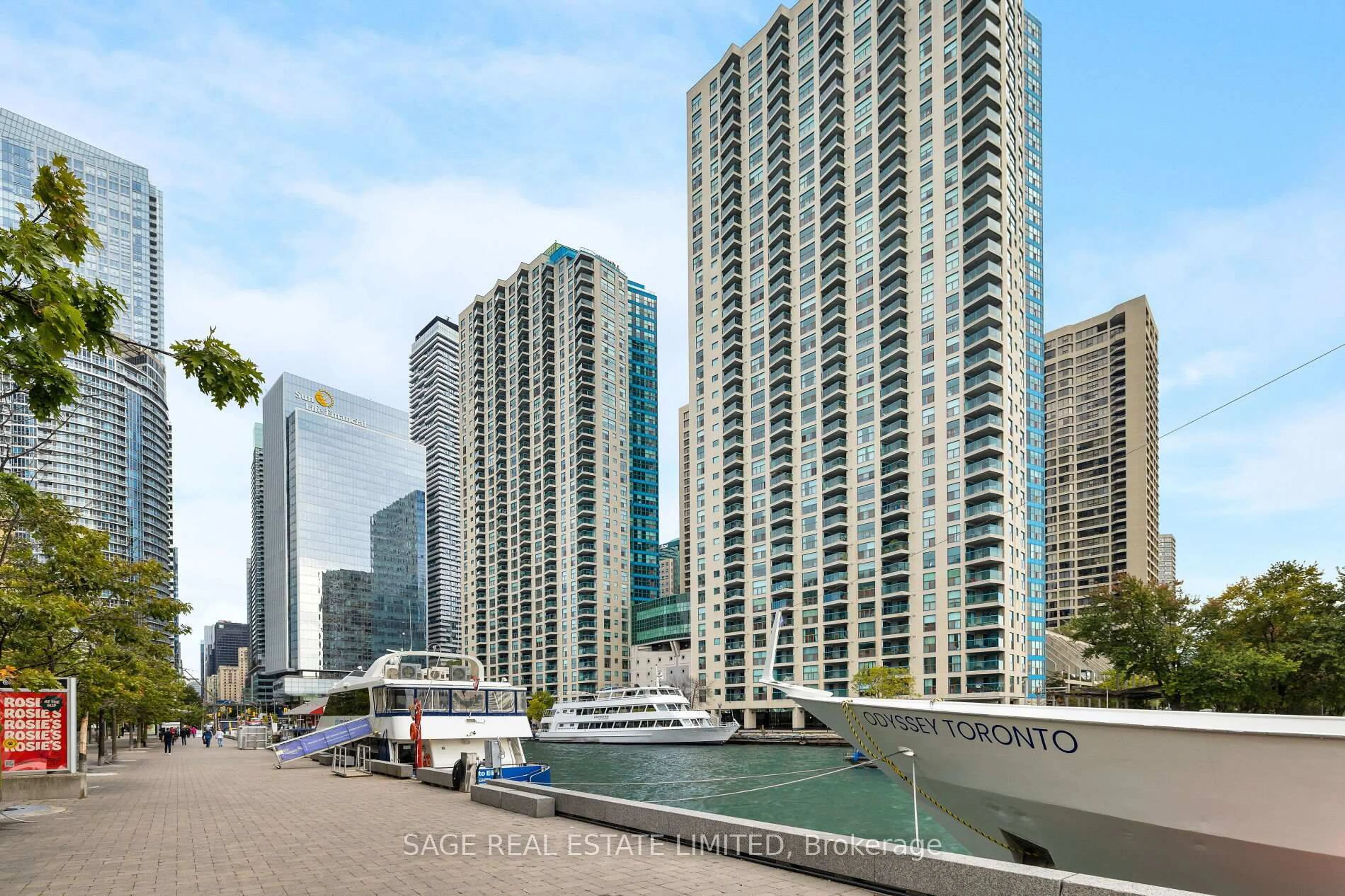 Patio, city buildings view from balcony for 99 Harbour Sq #3002, Toronto Ontario M5J 2H2