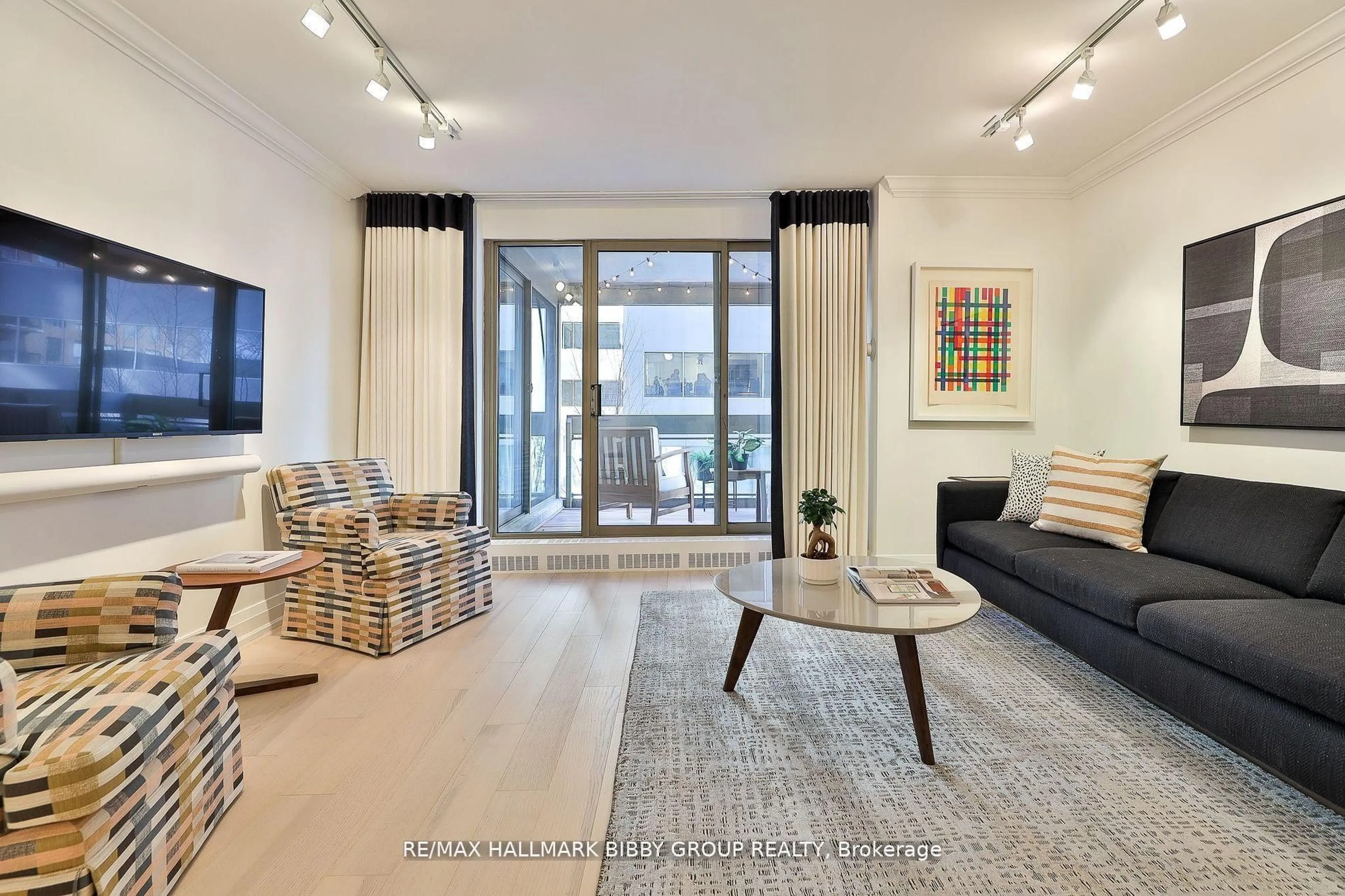 Living room with furniture, unknown for 61 St Clair Ave #206, Toronto Ontario M4V 2Y8