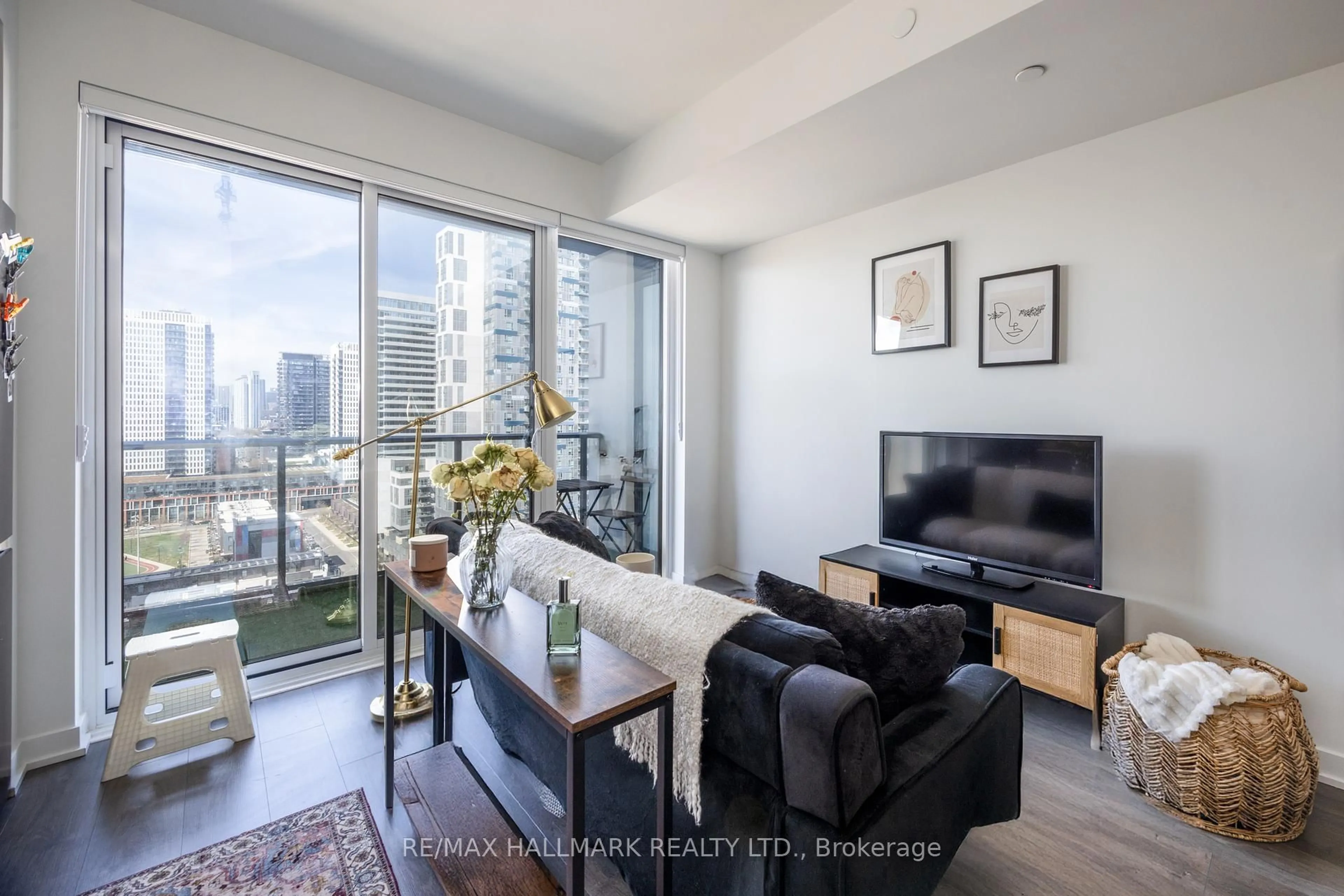Living room with furniture, wood/laminate floor for 5 Defries St #1507, Toronto Ontario M5A 0W7
