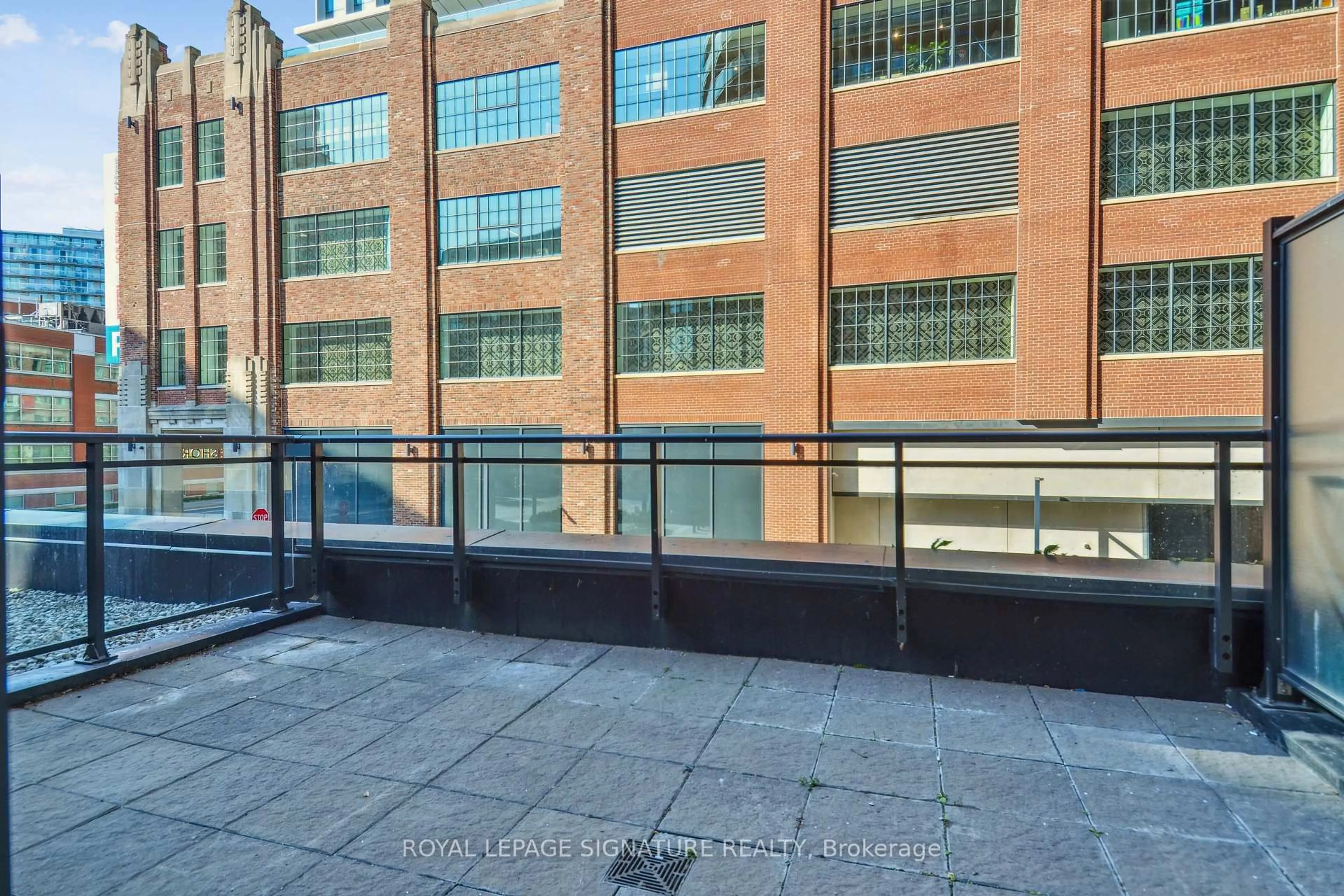 Patio, city buildings view from balcony for 38 Dan Leckie Way #223, Toronto Ontario M5V 2V6